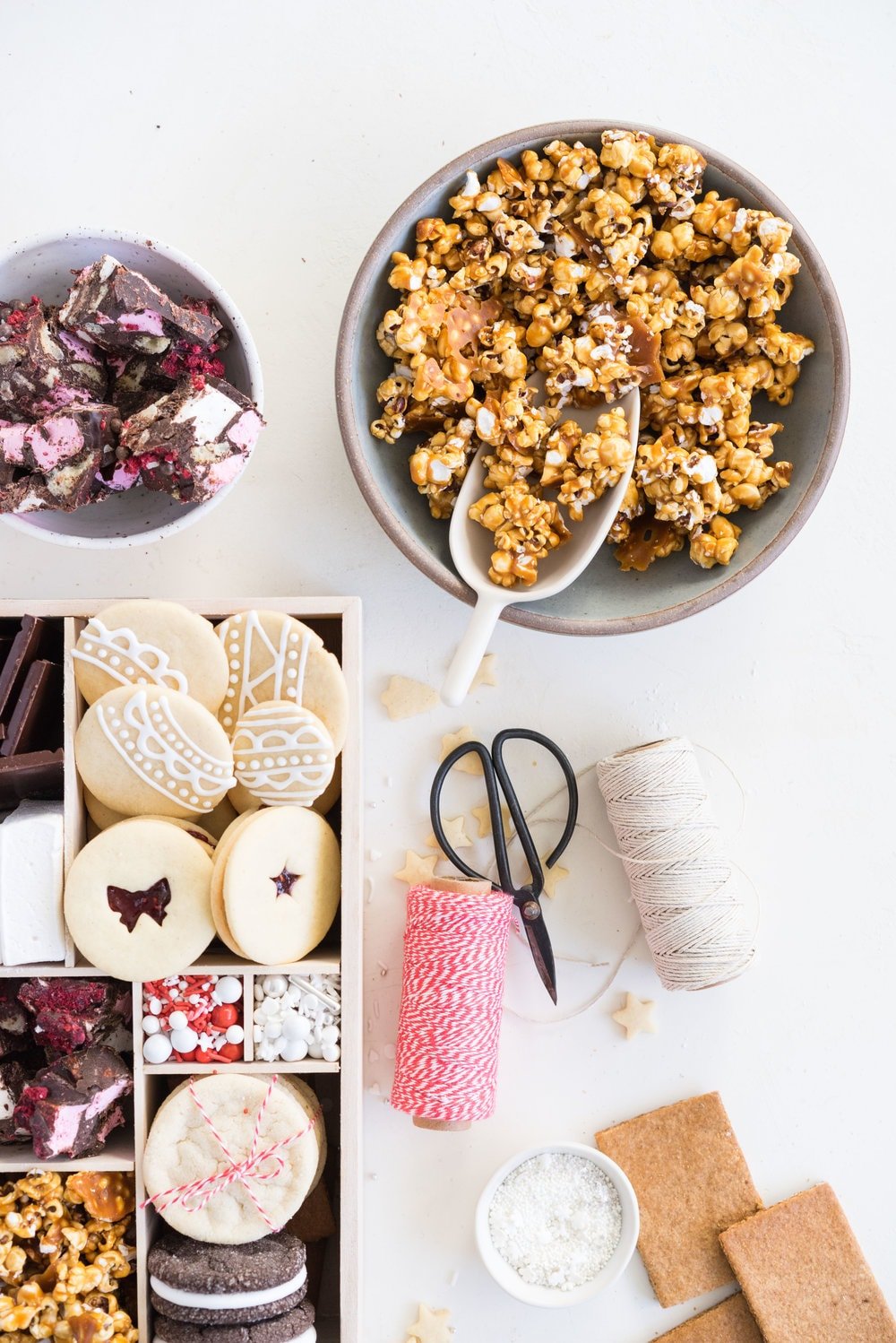 THE ultimate holiday cookie box - with something for everyone. Coconut ice, Honey Caramel Corn, sugar cookie marshmallow sandwiches, marshmallow and sugar cookie rocky road, piped roll out sugar cookies, and a DIY S'mores kit. What more could you wish for - this would be the perfect gift this holiday season.