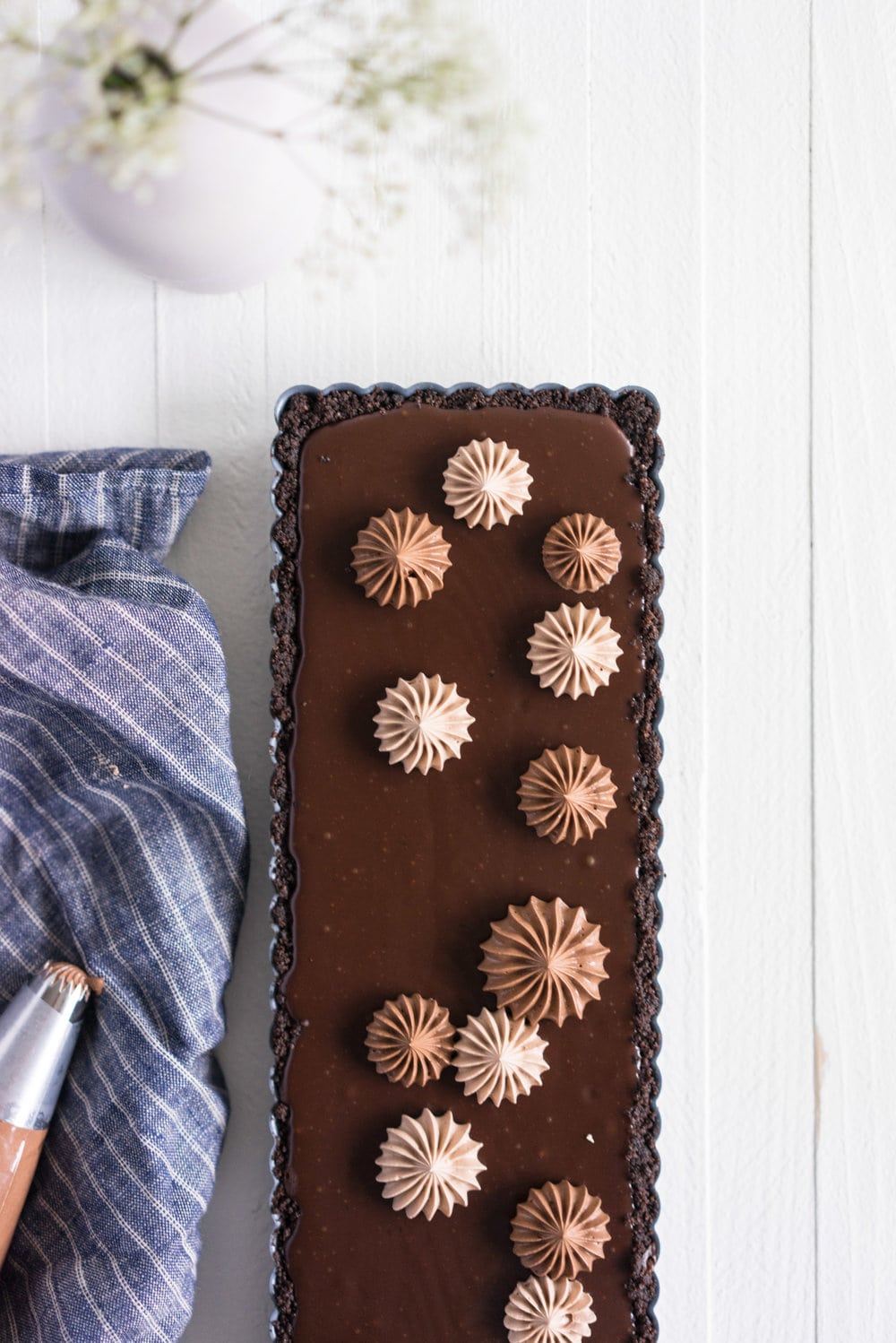 Milk Chocolate Earl Grey Tart with Ombre Dark Chocolate Swiss Meringue Buttercream. A press in cookie crust is topped with a silky earl grey infused ganache filling, then finished with an ombre swiss meringue buttercream.