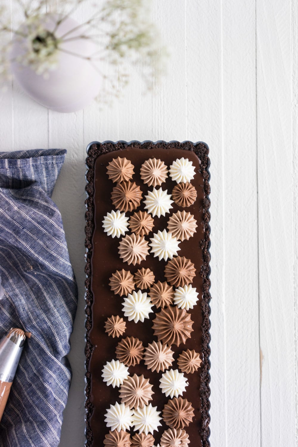 Milk Chocolate Earl Grey Tart with Ombre Dark Chocolate Swiss Meringue Buttercream. A press in cookie crust is topped with a silky earl grey infused ganache filling, then finished with an ombre swiss meringue buttercream.