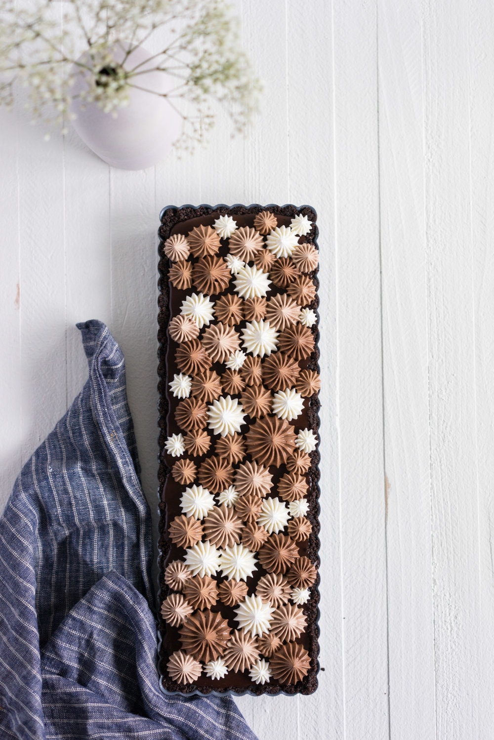 Milk Chocolate Earl Grey Tart with Ombre Dark Chocolate Swiss Meringue Buttercream. A press in cookie crust is topped with a silky earl grey infused ganache filling, then finished with an ombre swiss meringue buttercream.