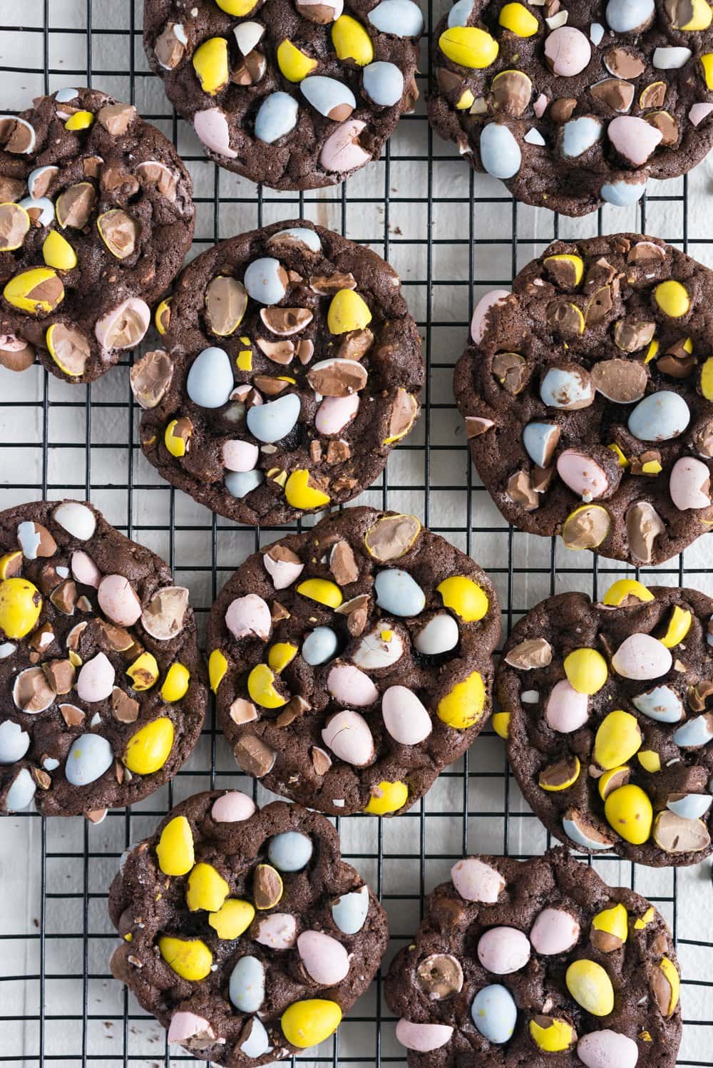 Milk Chocolate Mini Egg Cookies - the perfect addition to your easter baking schedule. These come together quickly, are super fun to make, and insanely delicious. Fudgy and chewy, chocolately and crispy, and loaded up with mini eggs.