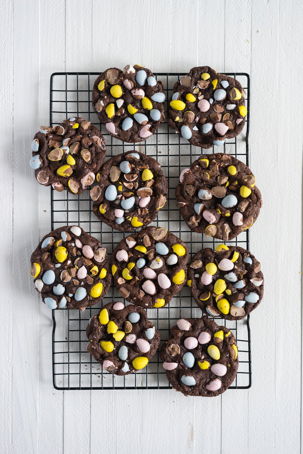 Milk Chocolate Mini Egg Cookies - the perfect addition to your easter baking schedule. These come together quickly, are super fun to make, and insanely delicious. Fudgy and chewy, chocolately and crispy, and loaded up with mini eggs.
