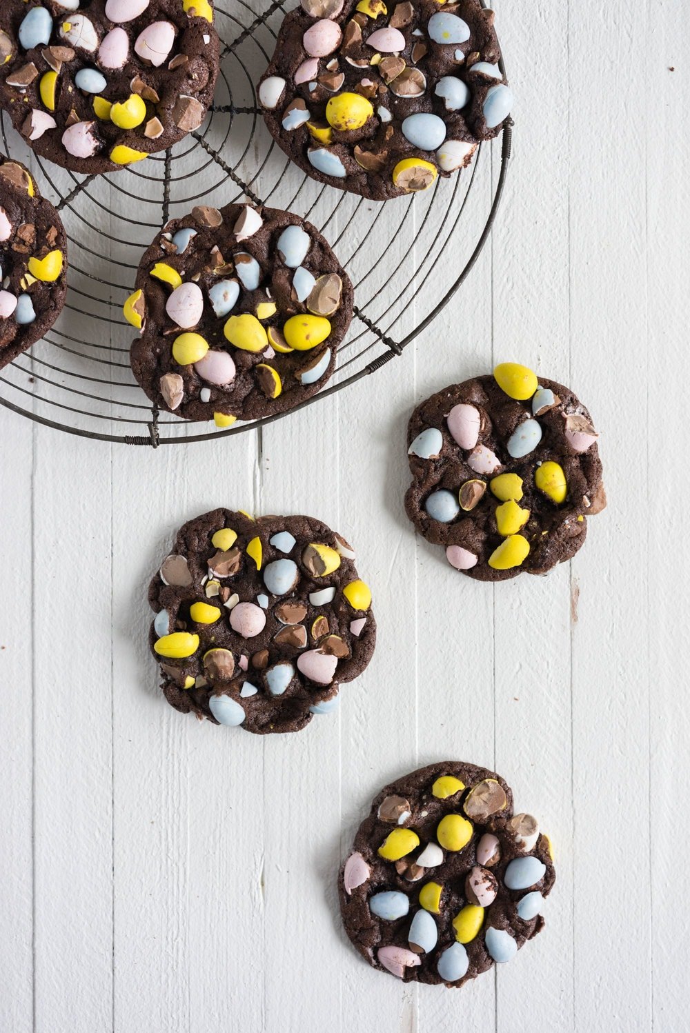 Milk Chocolate Mini Egg Cookies - the perfect addition to your easter baking schedule. These come together quickly, are super fun to make, and insanely delicious. Fudgy and chewy, chocolately and crispy, and loaded up with mini eggs.