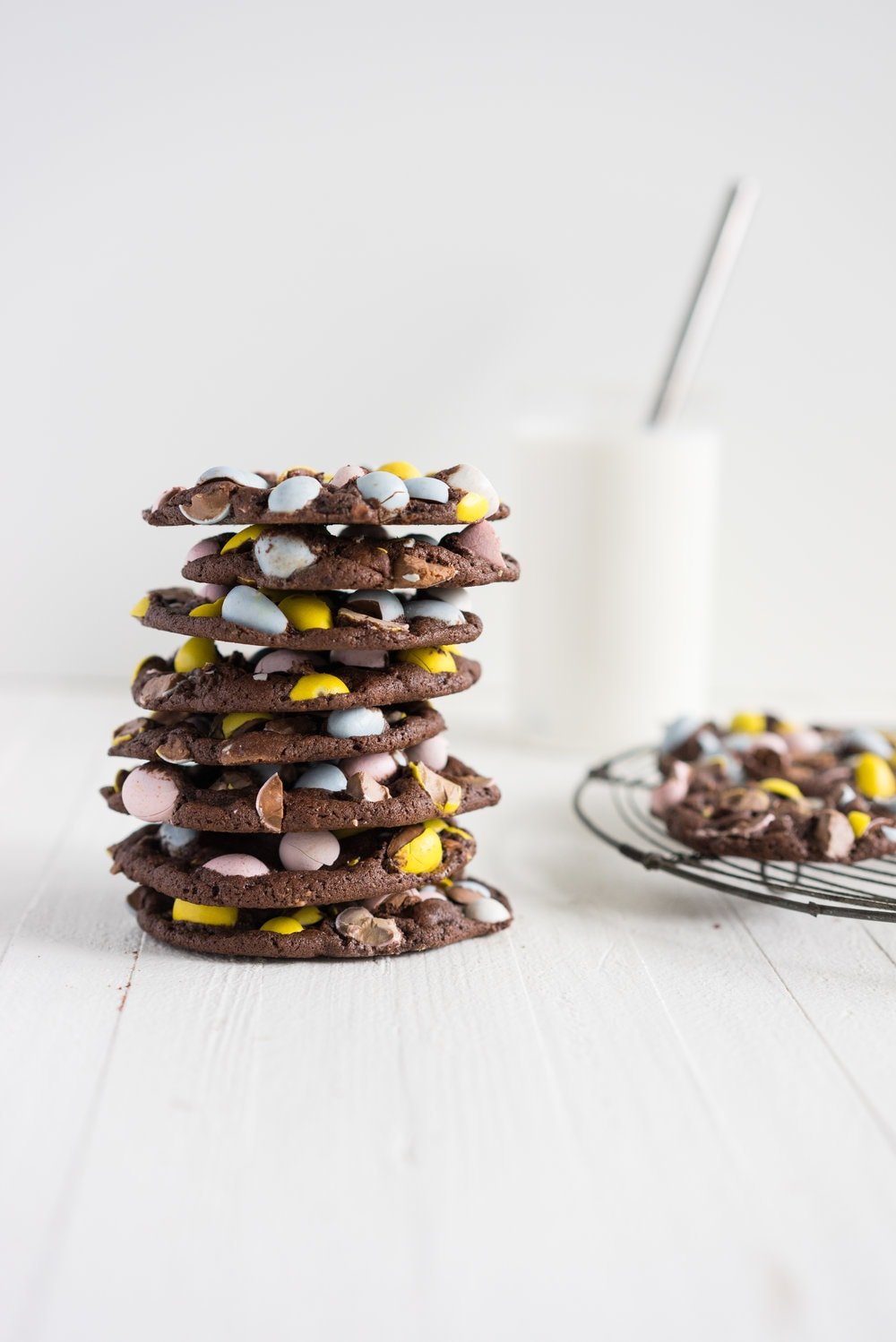 Milk Chocolate Mini Egg Cookies - the perfect addition to your easter baking schedule. These come together quickly, are super fun to make, and insanely delicious. Fudgy and chewy, chocolately and crispy, and loaded up with mini eggs.