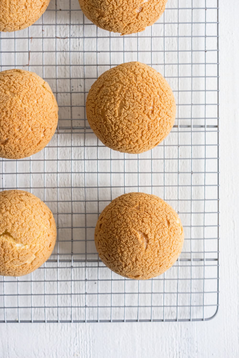 Choux au Craquelin (Cream Puffs) with Caramelised White Chocolate Whipping Ganache, Caramelised Bananas, and Pecan Brittle