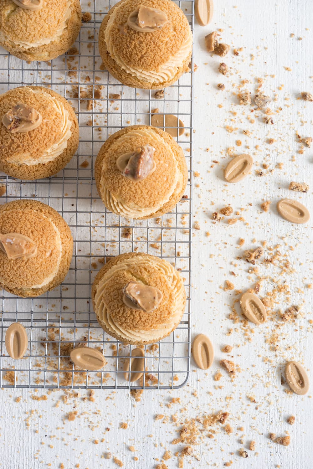 Choux au Craquelin (Cream Puffs) with Caramelised White Chocolate Whipping Ganache, Caramelised Bananas, and Pecan Brittle