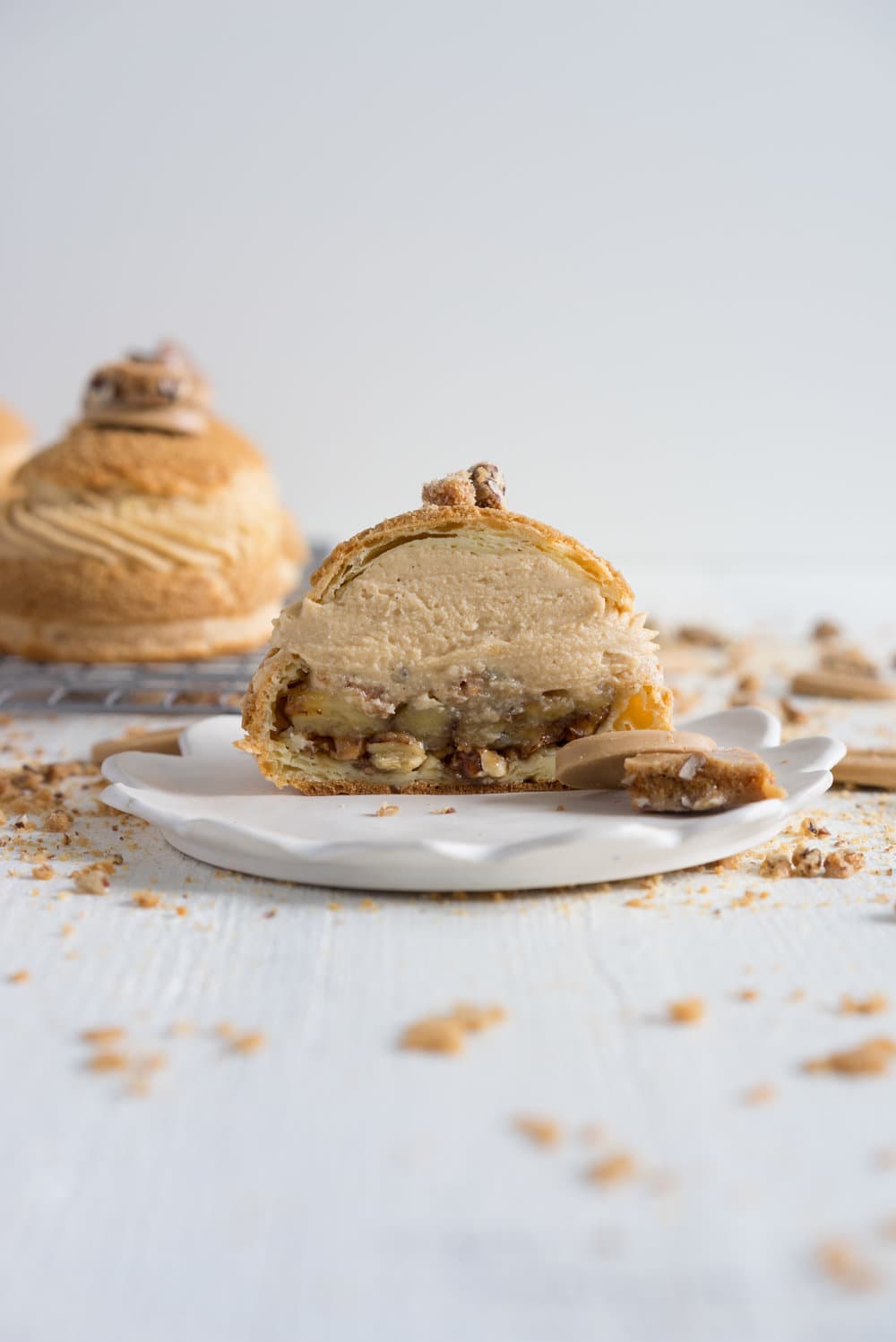 Choux au Craquelin (Cream Puffs) with Caramelised White Chocolate Whipping Ganache, Caramelised Bananas, and Pecan Brittle