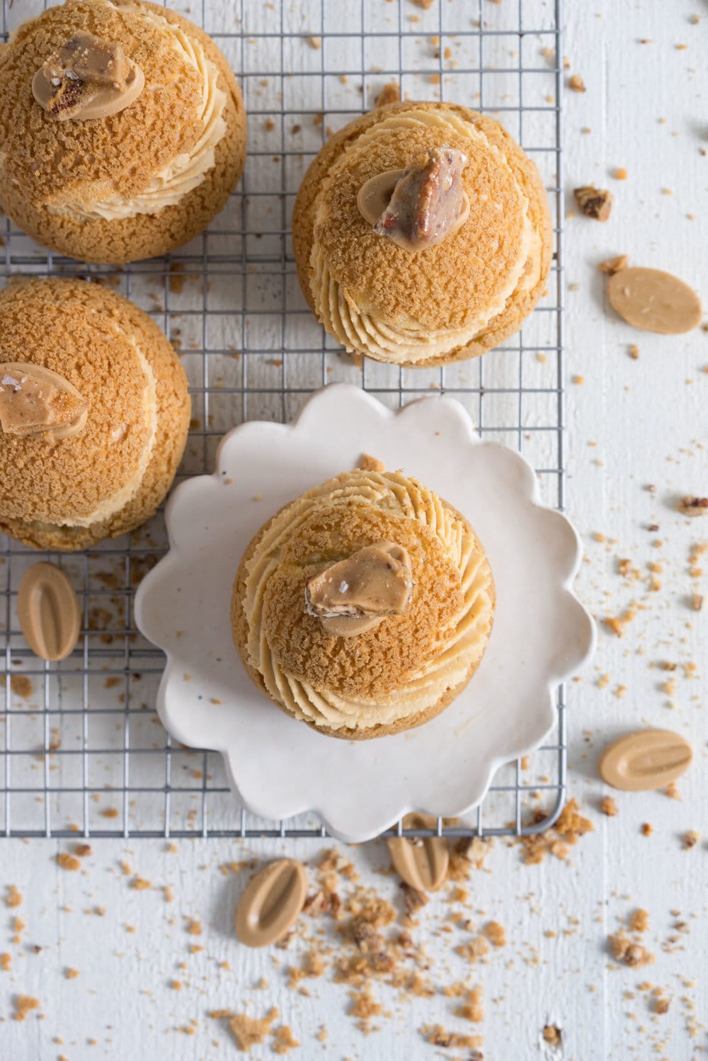 Choux au Craquelin (Cream Puffs) with Caramelised White Chocolate Whipping Ganache, Caramelised Bananas, and Pecan Brittle
