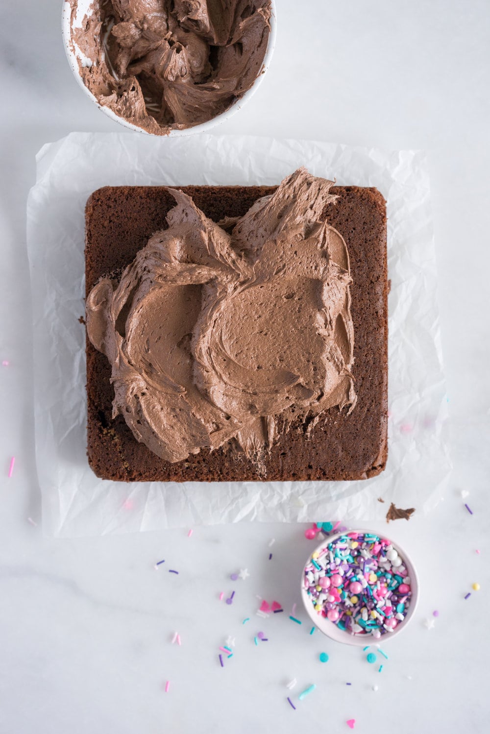 Chocolate Snack Cake with Chocolate Buttercream - the perfect cake recipe to have in your back pocket. Tender chocolate cake topped with fluffy chocolate buttercream #chocolatecake #snackcake