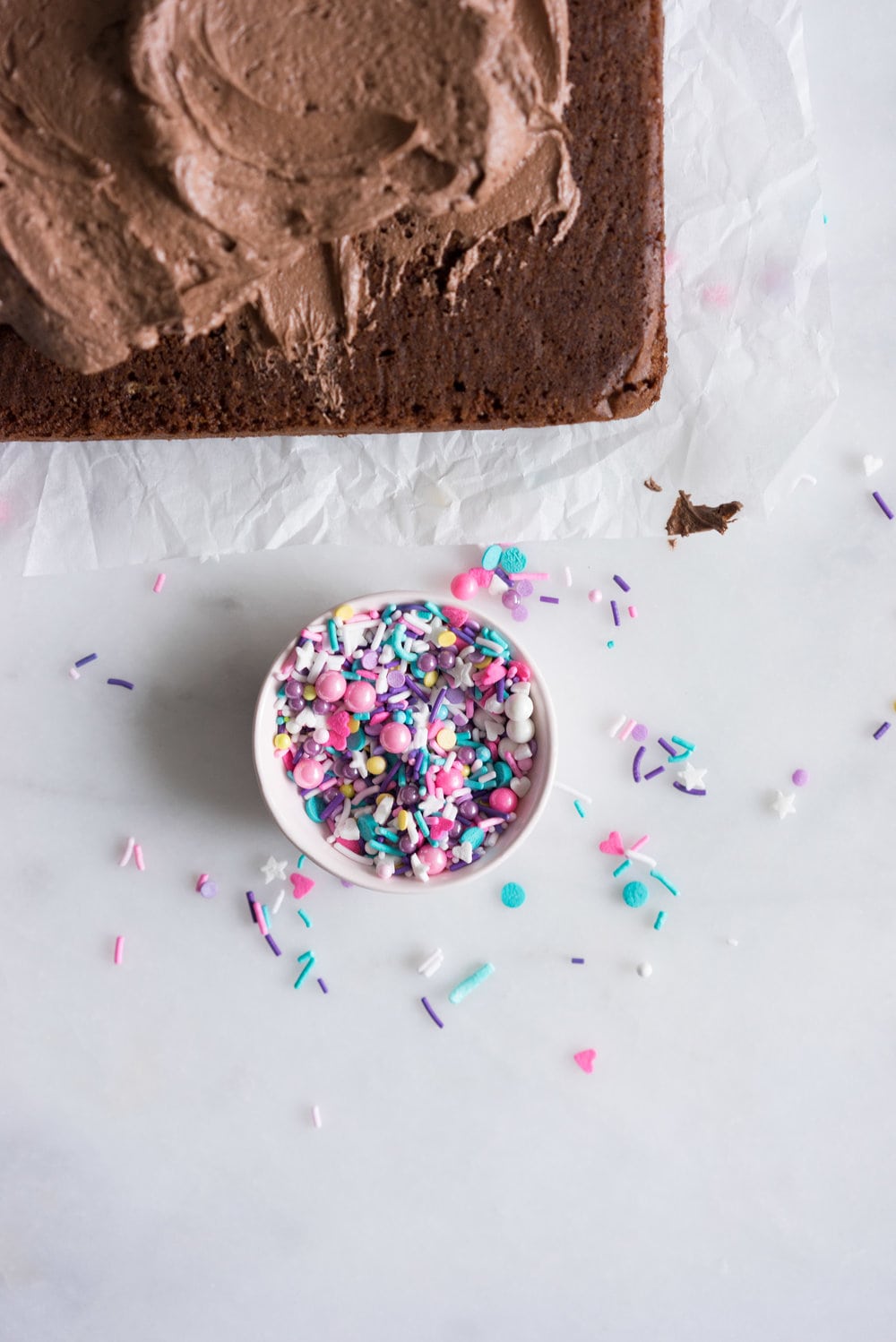 Chocolate Snack Cake with Chocolate Buttercream - the perfect cake recipe to have in your back pocket. Tender chocolate cake topped with fluffy chocolate buttercream #chocolatecake #snackcake