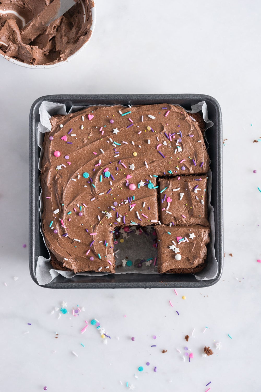Chocolate Snack Cake with Chocolate Buttercream - the perfect cake recipe to have in your back pocket. Tender chocolate cake topped with fluffy chocolate buttercream #chocolatecake #snackcake