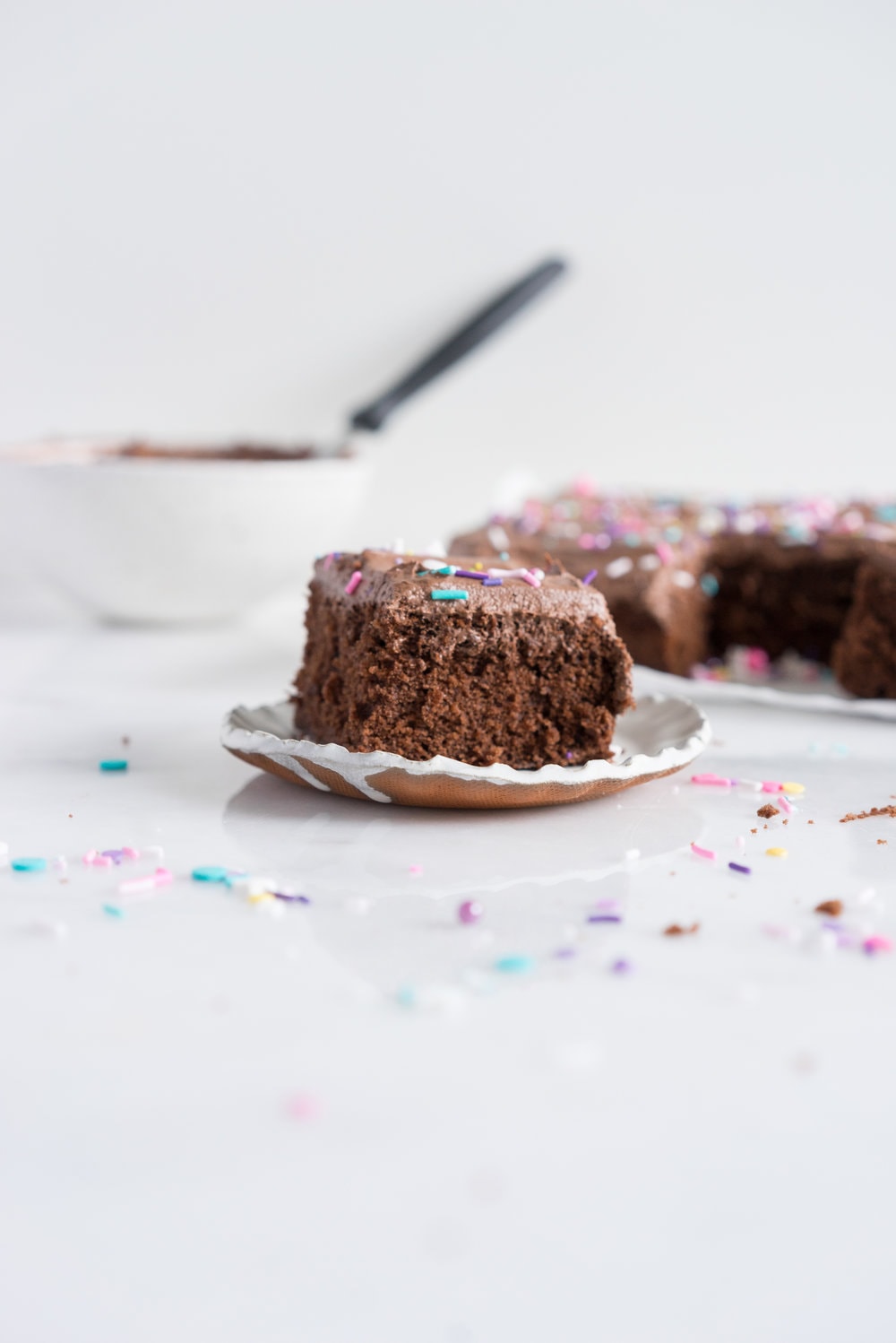 Chocolate Snack Cake with Chocolate Buttercream - the perfect cake recipe to have in your back pocket. Tender chocolate cake topped with fluffy chocolate buttercream #chocolatecake #snackcake