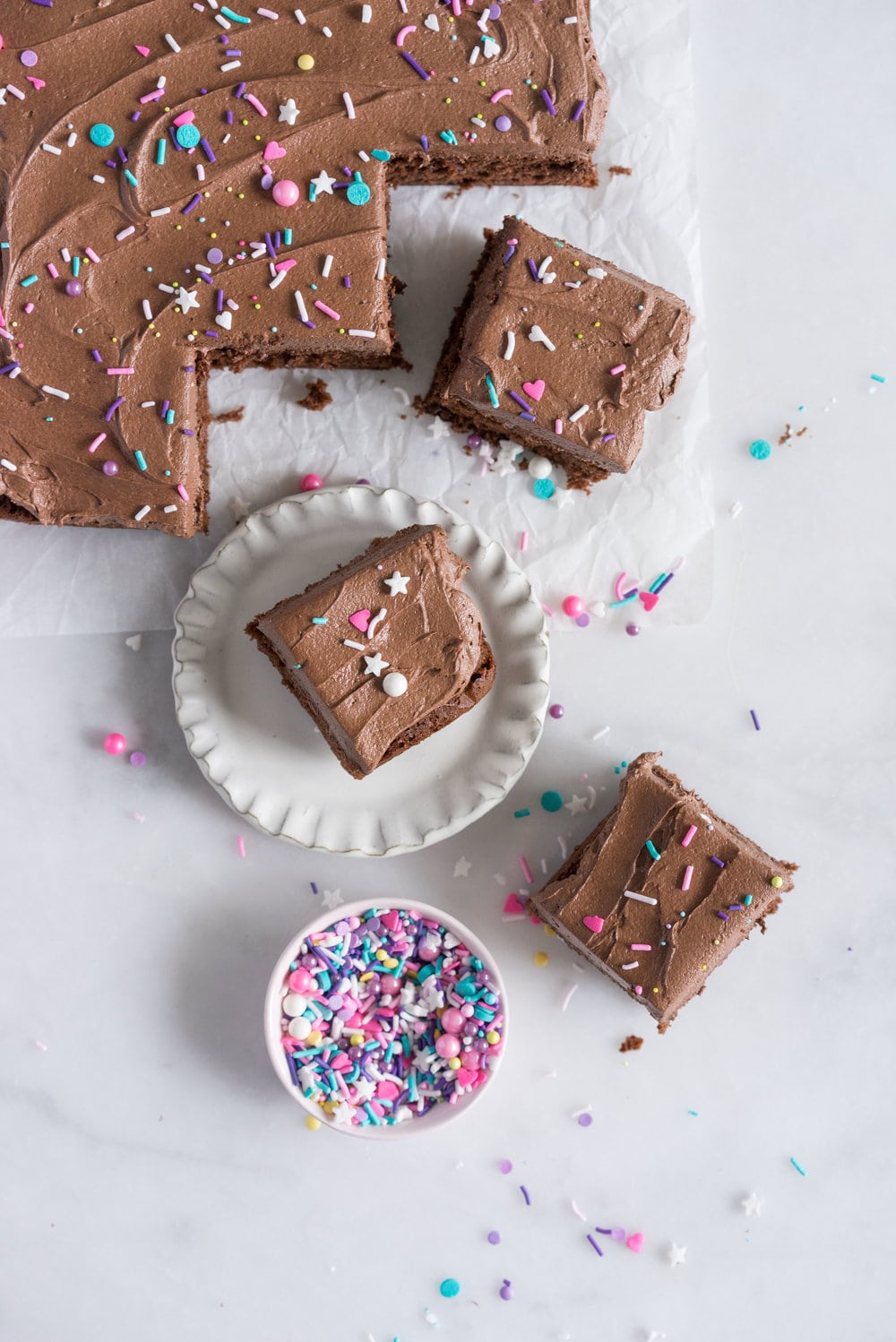 Chocolate Snack Cake with Chocolate Buttercream - the perfect cake recipe to have in your back pocket. Tender chocolate cake topped with fluffy chocolate buttercream #chocolatecake #snackcake