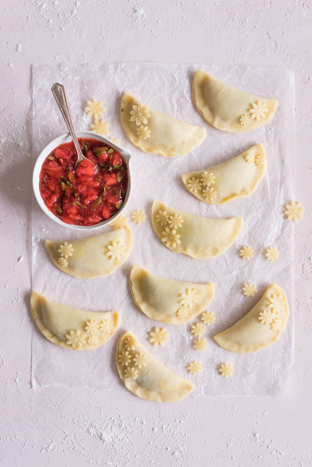 Strawberry Basil Hand Pies - Strawberries are cooked down with basil and black pepper until they are perfectly jammy, then enclosed in tender flaky pie dough. The perfect summer treat. #Strawberry #Basil #Handpie
