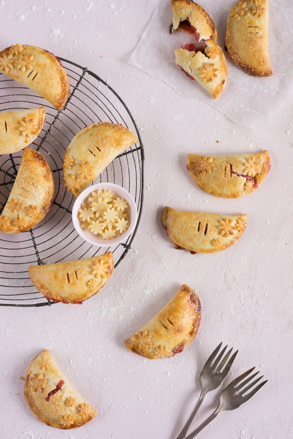 Strawberry Basil Hand Pies - Strawberries are cooked down with basil and black pepper until they are perfectly jammy, then enclosed in tender flaky pie dough. The perfect summer treat. #Strawberry #Basil #Handpie