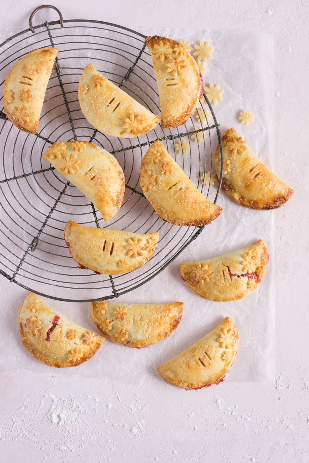 Strawberry Basil Hand Pies - Strawberries are cooked down with basil and black pepper until they are perfectly jammy, then enclosed in tender flaky pie dough. The perfect summer treat. #Strawberry #Basil #Handpie