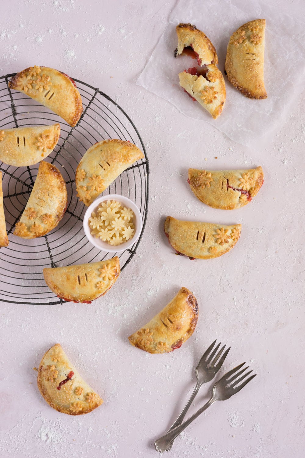 Strawberry Basil Hand Pies - Strawberries are cooked down with basil and black pepper until they are perfectly jammy, then enclosed in tender flaky pie dough. The perfect summer treat. #Strawberry #Basil #Handpie