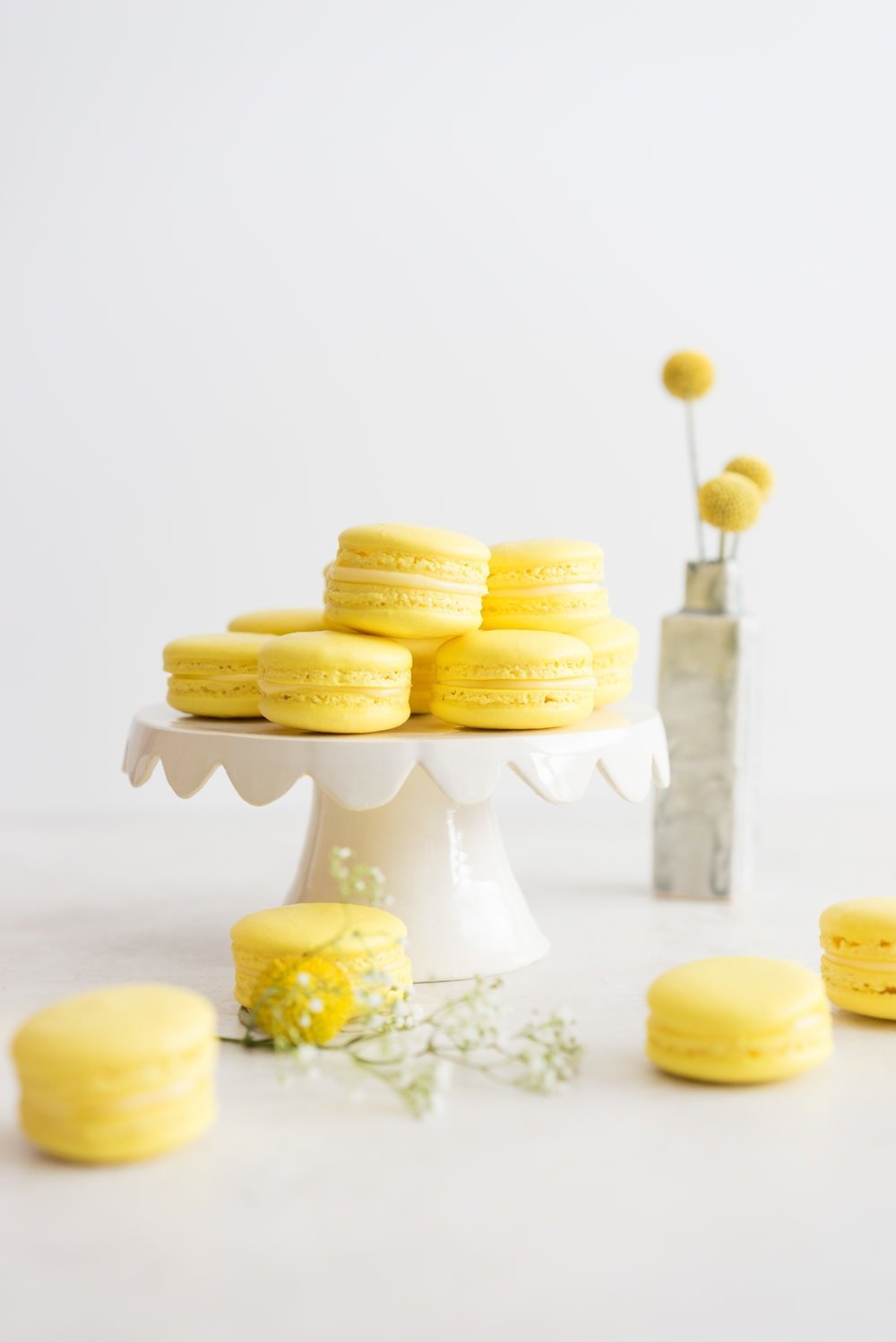 Lemon and Basil Macarons - French Macaron shells are filled with a lemon and basil cream, and a tart lemon gel. Delicate an intense flavours meld together to create the perfect bite.