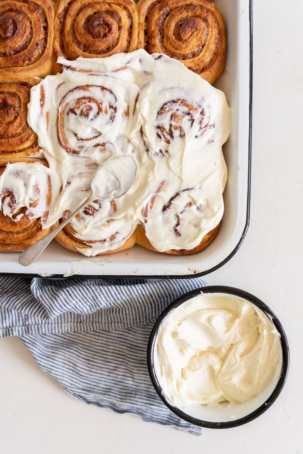 Rhubarb Sticky Buns - Brioche Spiked with vanilla, filled with rhubarb quick jam, and finished with a vanilla bean mascarpone frosting. #stickybuns #rhubarb #vanillabean #cloudykitchen