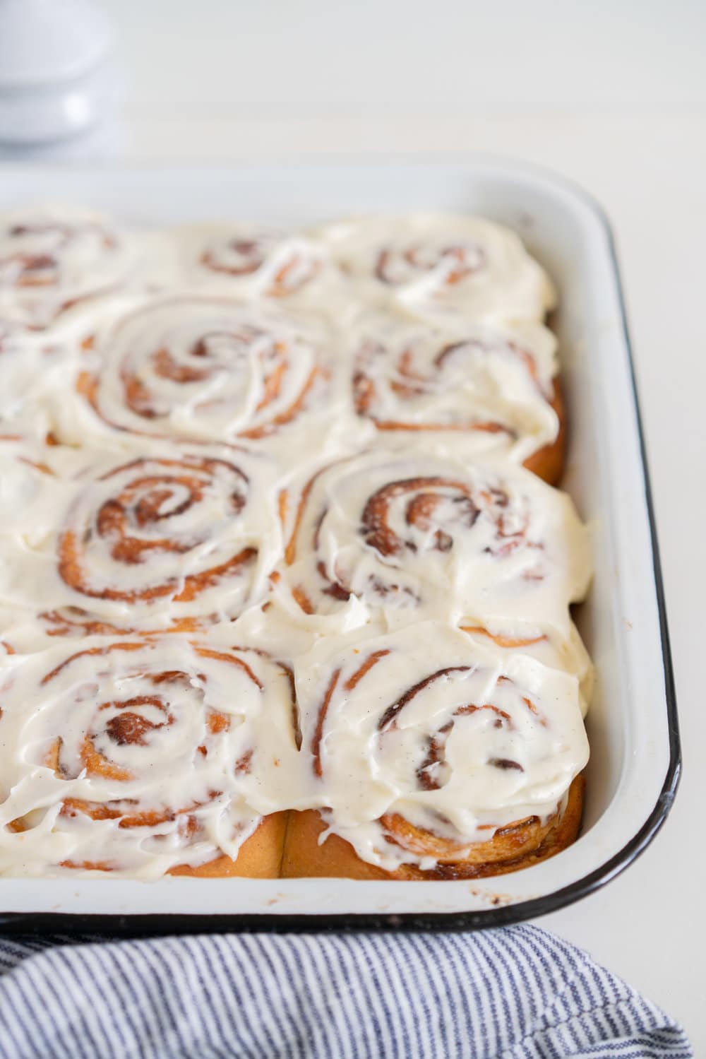 Rhubarb Sticky Buns - Brioche Spiked with vanilla, filled with rhubarb quick jam, and finished with a vanilla bean mascarpone frosting. #stickybuns #rhubarb #vanillabean #cloudykitchen