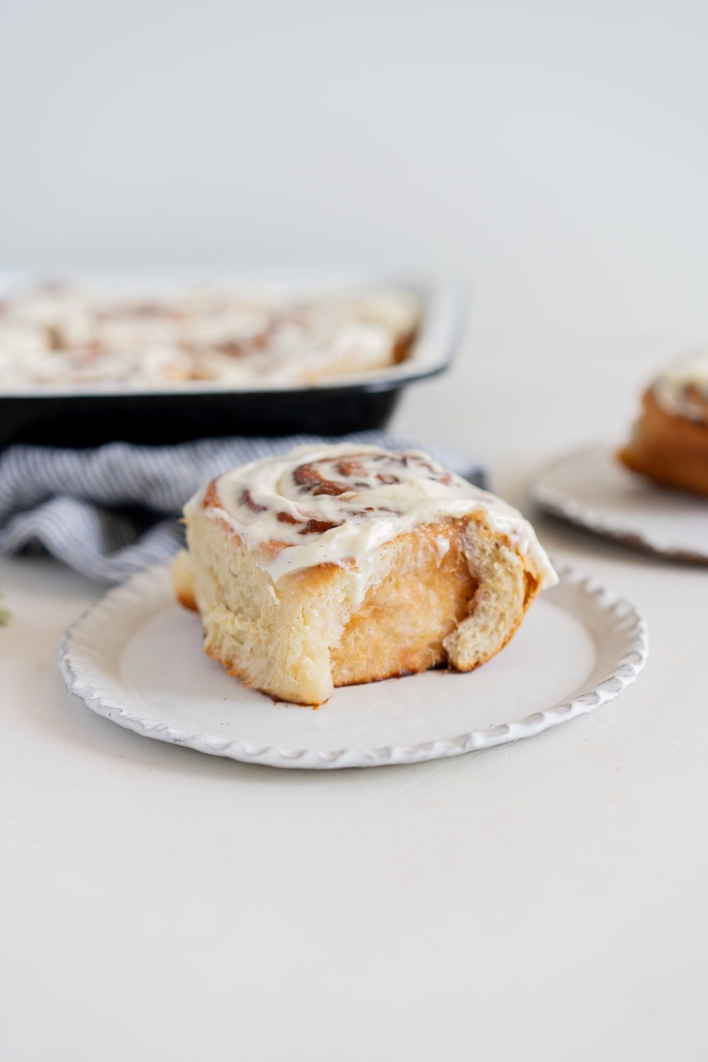 Rhubarb Sticky Buns - Brioche Spiked with vanilla, filled with rhubarb quick jam, and finished with a vanilla bean mascarpone frosting. #stickybuns #rhubarb #vanillabean #cloudykitchen