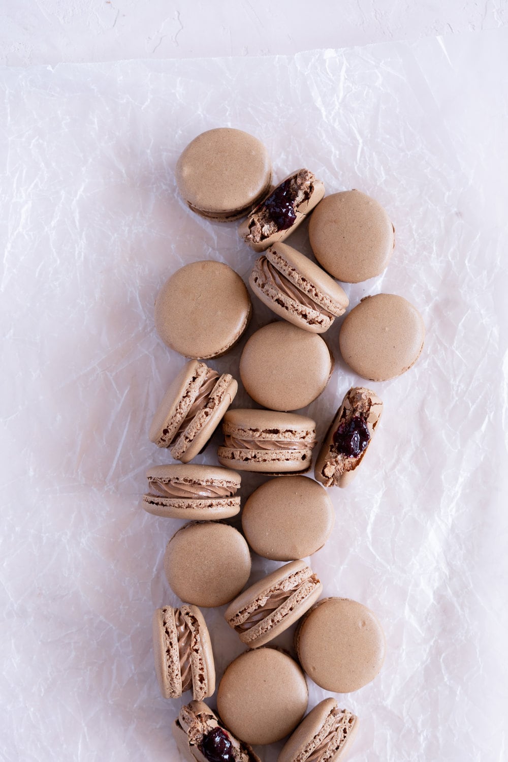 Black Forest inspired Macarons - chocolate macarons with Dark Chocolate Swiss Meringue Buttercream and Cherry Compote Filling. #Chocolate #Macaron #Blackforest #cherry #compote #Frenchmacaron