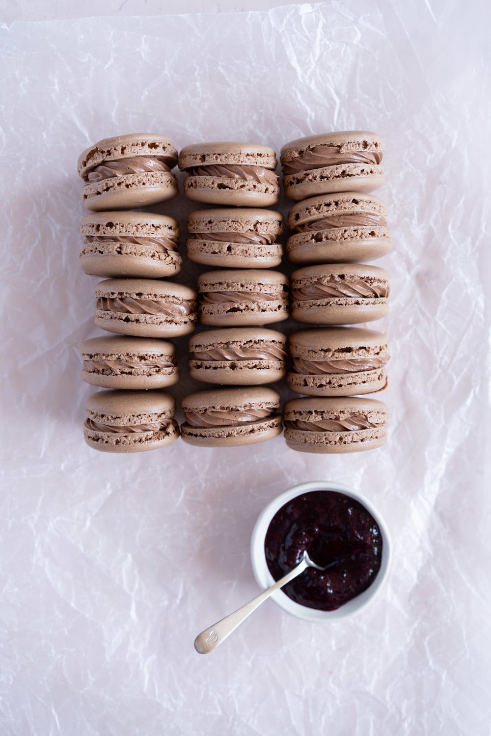 Black Forest inspired Macarons - chocolate macarons with Dark Chocolate Swiss Meringue Buttercream and Cherry Compote Filling. #Chocolate #Macaron #Blackforest #cherry #compote #Frenchmacaron