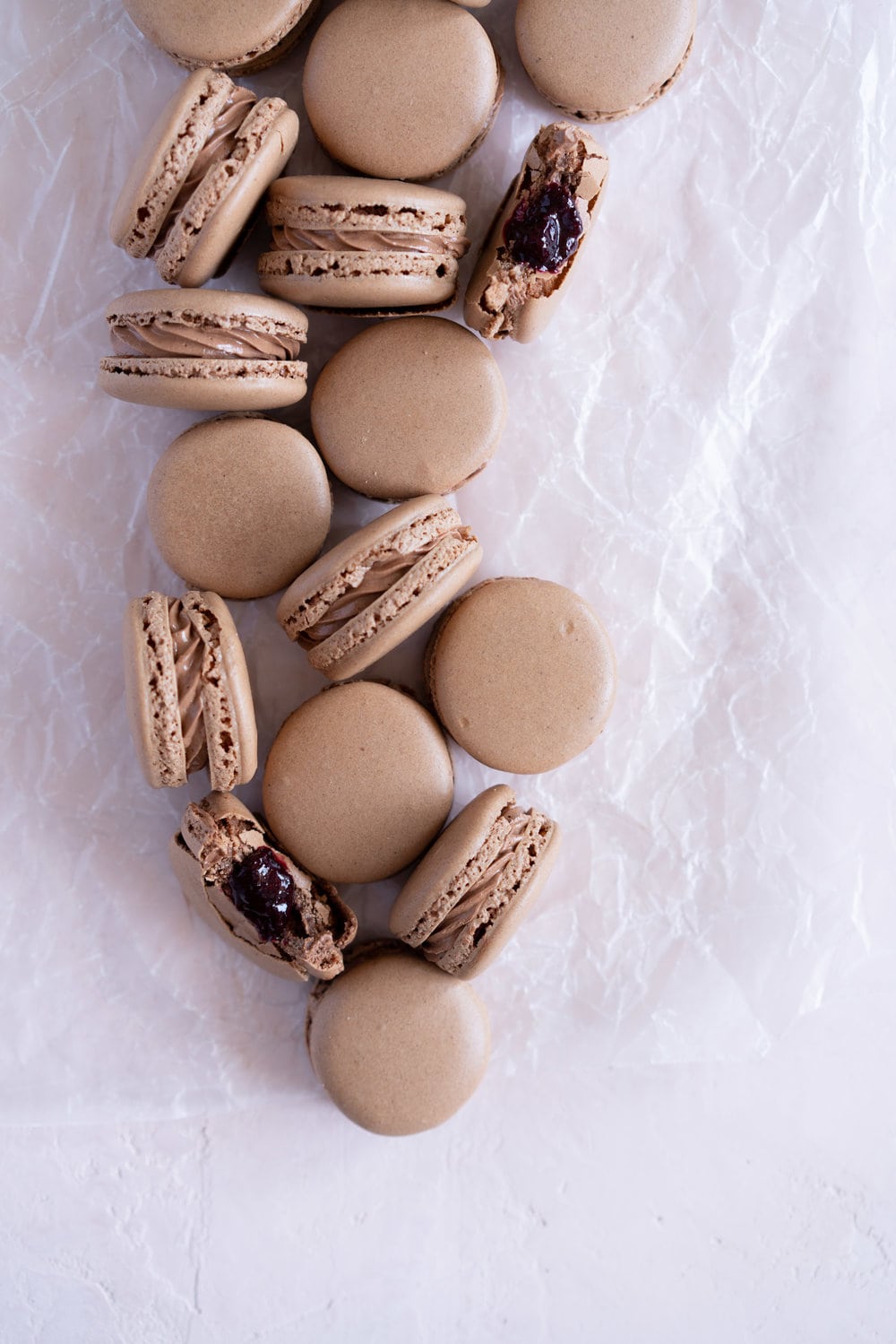 Black Forest inspired Macarons - chocolate macarons with Dark Chocolate Swiss Meringue Buttercream and Cherry Compote Filling. #Chocolate #Macaron #Blackforest #cherry #compote #Frenchmacaron