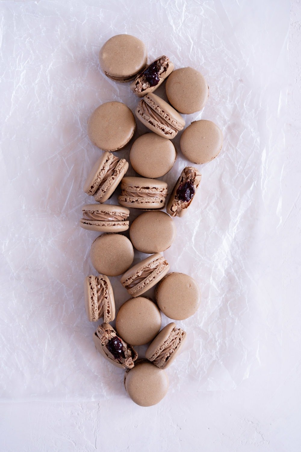 Black Forest inspired Macarons - chocolate macarons with Dark Chocolate Swiss Meringue Buttercream and Cherry Compote Filling. #Chocolate #Macaron #Blackforest #cherry #compote #Frenchmacaron
