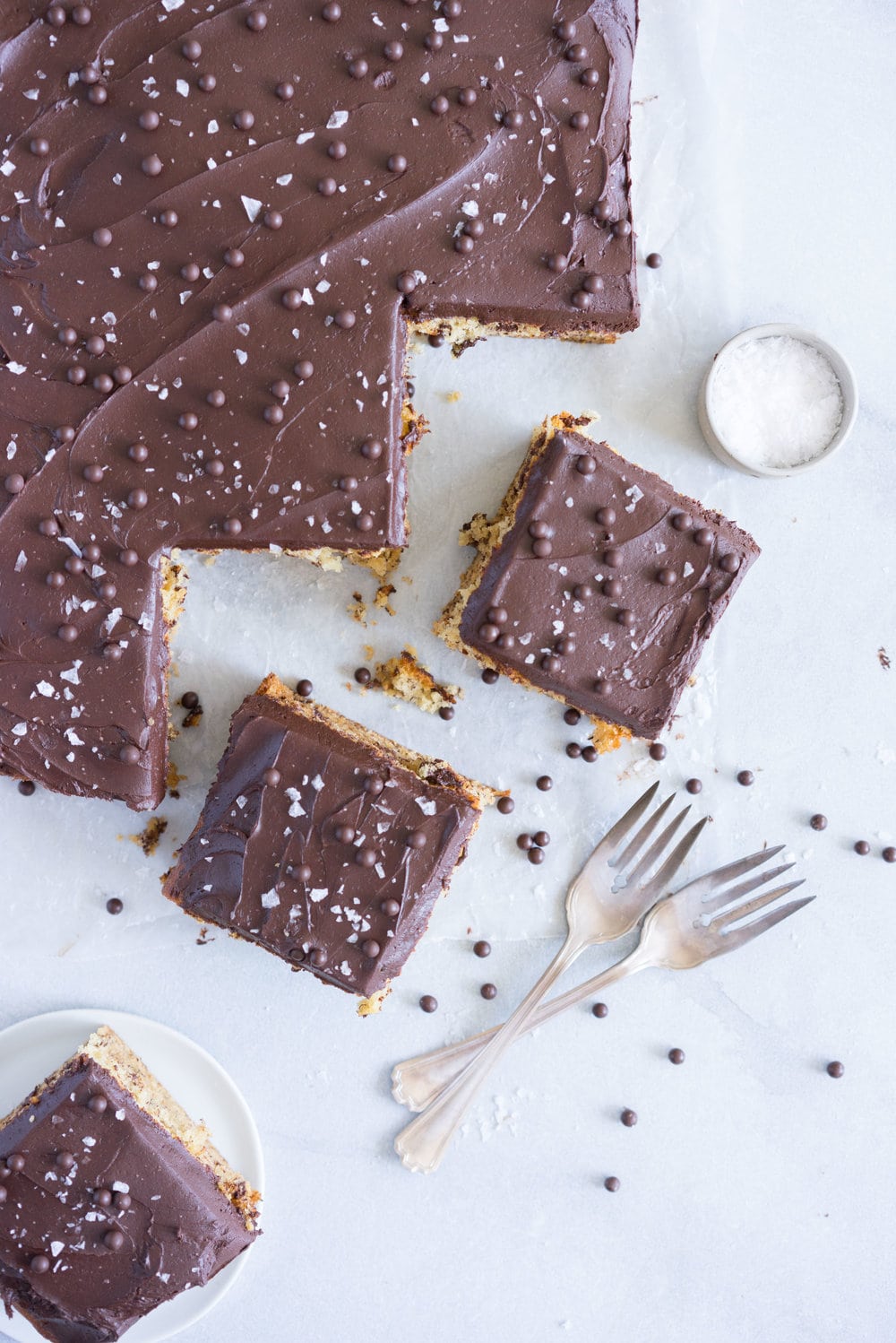 Banana Sheet Cake with Whipped Dark Chocolate Ganache. A little bit fancy but perfect for a crowd, this banana sheet cake will be your secret dessert weapon! #bananacake #sheetcake #chocolateganache #chocolatefrosting