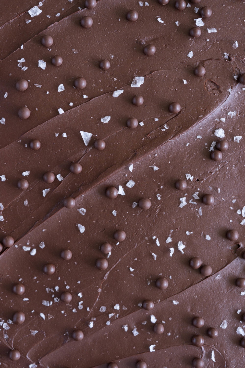 Banana Sheet Cake with Whipped Dark Chocolate Ganache. A little bit fancy but perfect for a crowd, this banana sheet cake will be your secret dessert weapon! #bananacake #sheetcake #chocolateganache #chocolatefrosting