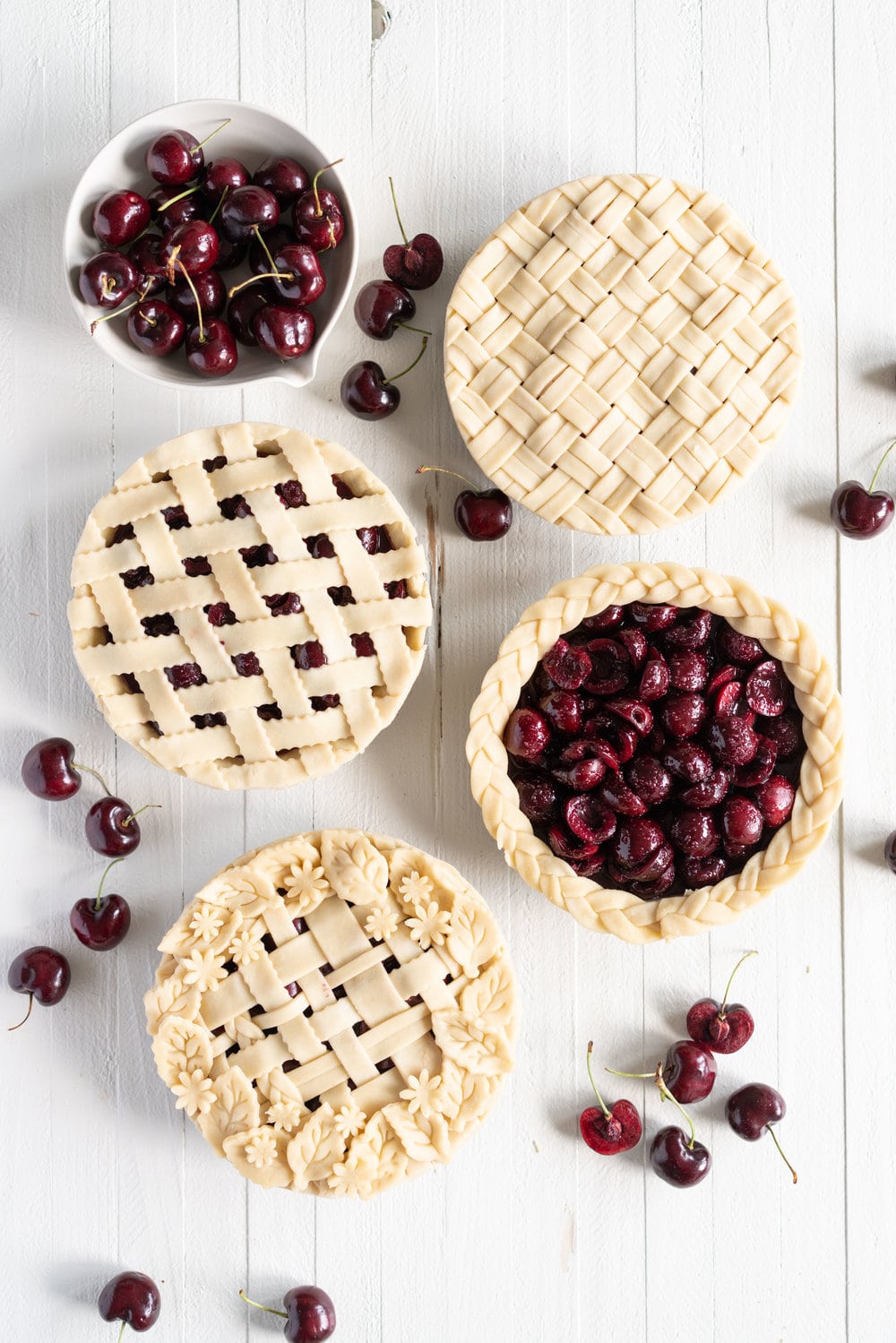 When you have beautiful, in season cherries, it really is a shame to do anything with it other than make Cherry Pie! These cherry pies are perfectly juicy, with the right balance of sweetness, and have a tender, flaky crust. They are easy to make, can be prepared ahead, and make the perfect summer dessert. #pie #cherrypie #recipe #darkcherrypie #fruitpie