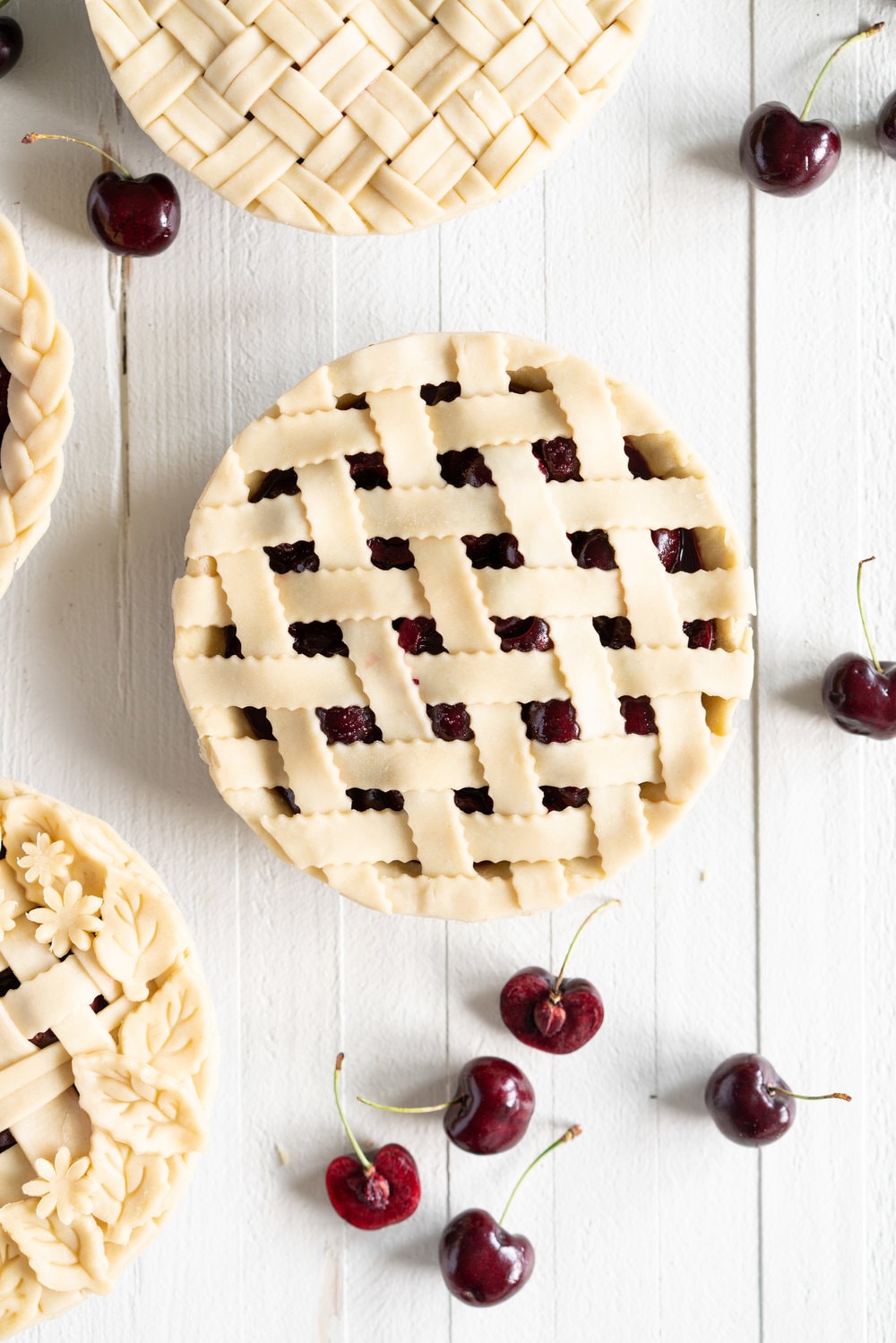 When you have beautiful, in season cherries, it really is a shame to do anything with it other than make Cherry Pie! These cherry pies are perfectly juicy, with the right balance of sweetness, and have a tender, flaky crust. They are easy to make, can be prepared ahead, and make the perfect summer dessert. #pie #cherrypie #recipe #darkcherrypie #fruitpie