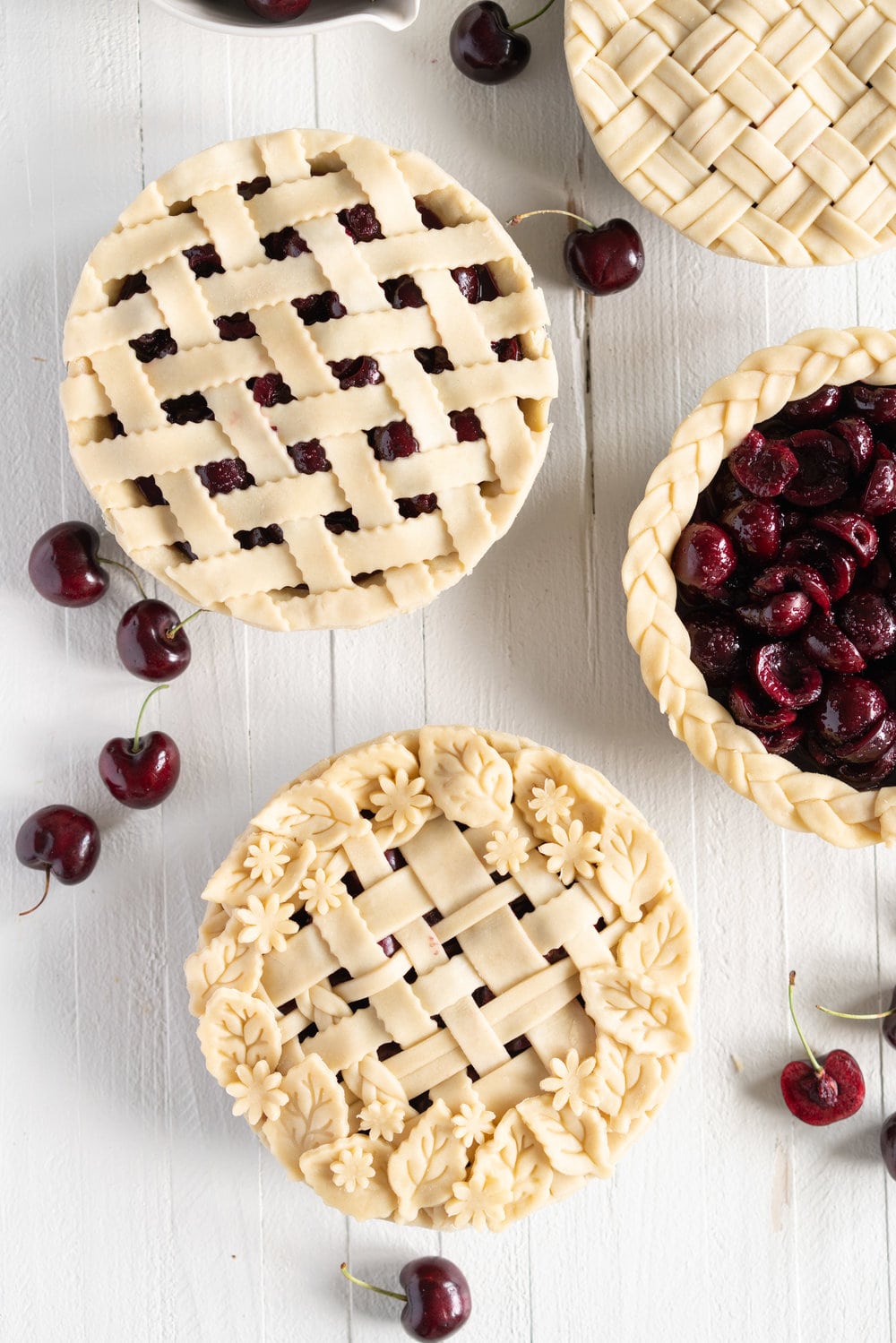When you have beautiful, in season cherries, it really is a shame to do anything with it other than make Cherry Pie! These cherry pies are perfectly juicy, with the right balance of sweetness, and have a tender, flaky crust. They are easy to make, can be prepared ahead, and make the perfect summer dessert. #pie #cherrypie #recipe #darkcherrypie #fruitpie