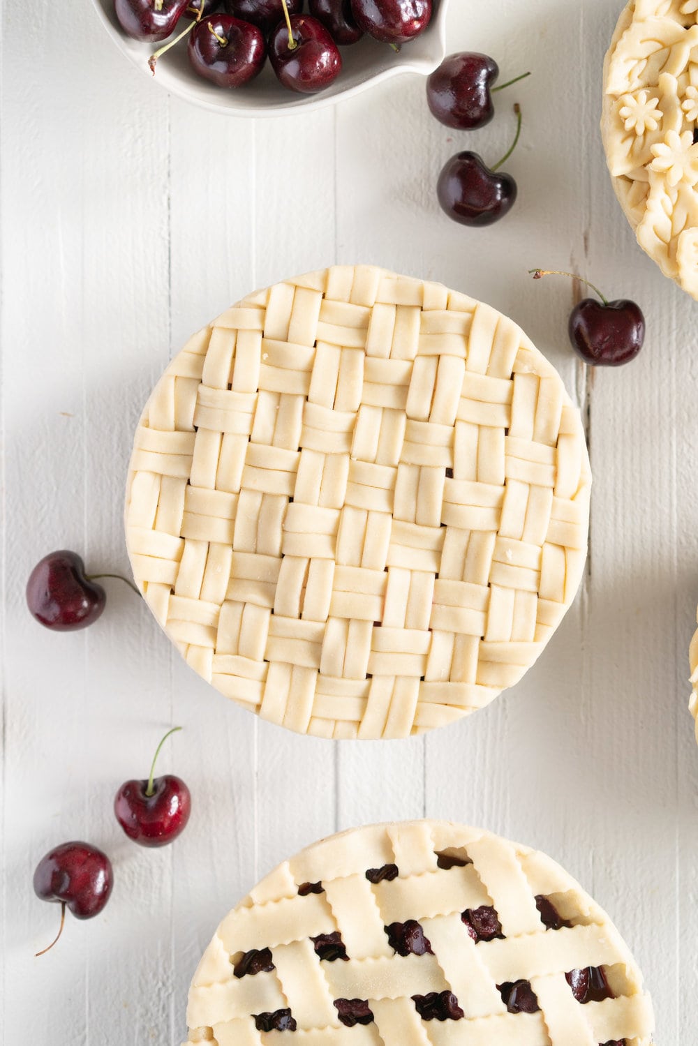 When you have beautiful, in season cherries, it really is a shame to do anything with it other than make Cherry Pie! These cherry pies are perfectly juicy, with the right balance of sweetness, and have a tender, flaky crust. They are easy to make, can be prepared ahead, and make the perfect summer dessert. #pie #cherrypie #recipe #darkcherrypie #fruitpie