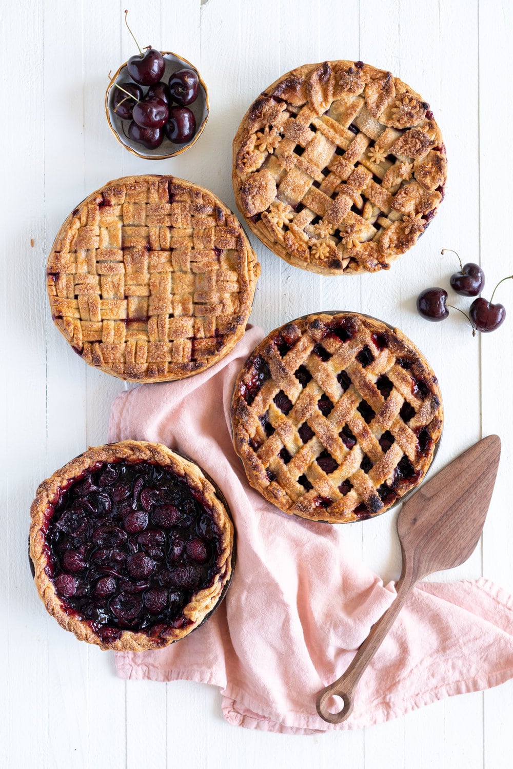 When you have beautiful, in season cherries, it really is a shame to do anything with it other than make Cherry Pie! These cherry pies are perfectly juicy, with the right balance of sweetness, and have a tender, flaky crust. They are easy to make, can be prepared ahead, and make the perfect summer dessert. #pie #cherrypie #recipe #darkcherrypie #fruitpie