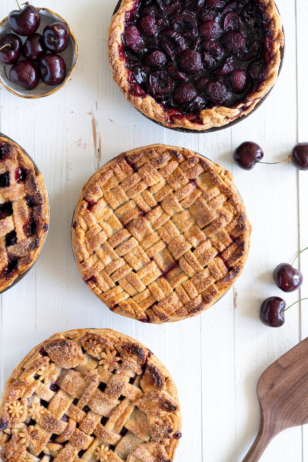 When you have beautiful, in season cherries, it really is a shame to do anything with it other than make Cherry Pie! These cherry pies are perfectly juicy, with the right balance of sweetness, and have a tender, flaky crust. They are easy to make, can be prepared ahead, and make the perfect summer dessert. #pie #cherrypie #recipe #darkcherrypie #fruitpie