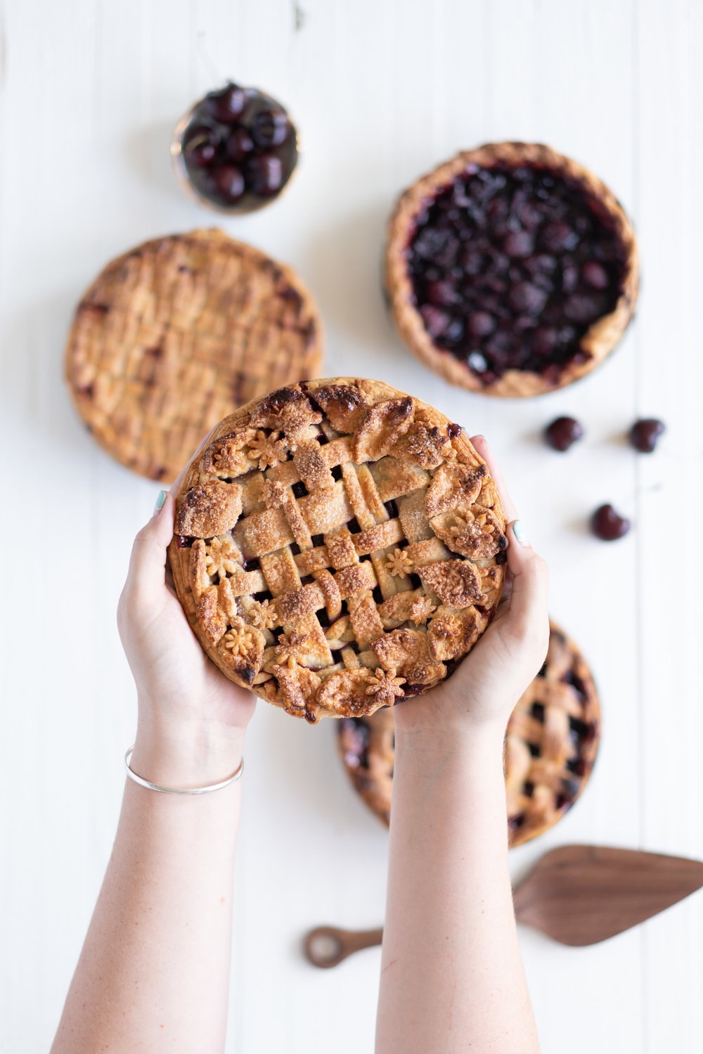 When you have beautiful, in season cherries, it really is a shame to do anything with it other than make Cherry Pie! These cherry pies are perfectly juicy, with the right balance of sweetness, and have a tender, flaky crust. They are easy to make, can be prepared ahead, and make the perfect summer dessert. #pie #cherrypie #recipe #darkcherrypie #fruitpie
