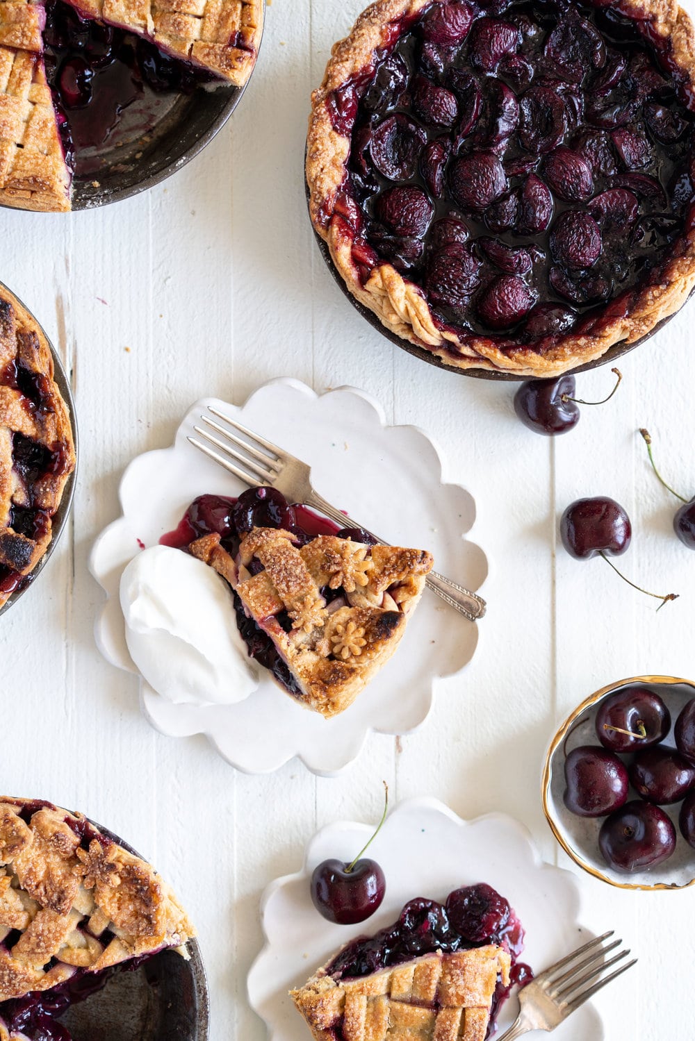 When you have beautiful, in season cherries, it really is a shame to do anything with it other than make Cherry Pie! These cherry pies are perfectly juicy, with the right balance of sweetness, and have a tender, flaky crust. They are easy to make, can be prepared ahead, and make the perfect summer dessert. #pie #cherrypie #recipe #darkcherrypie #fruitpie
