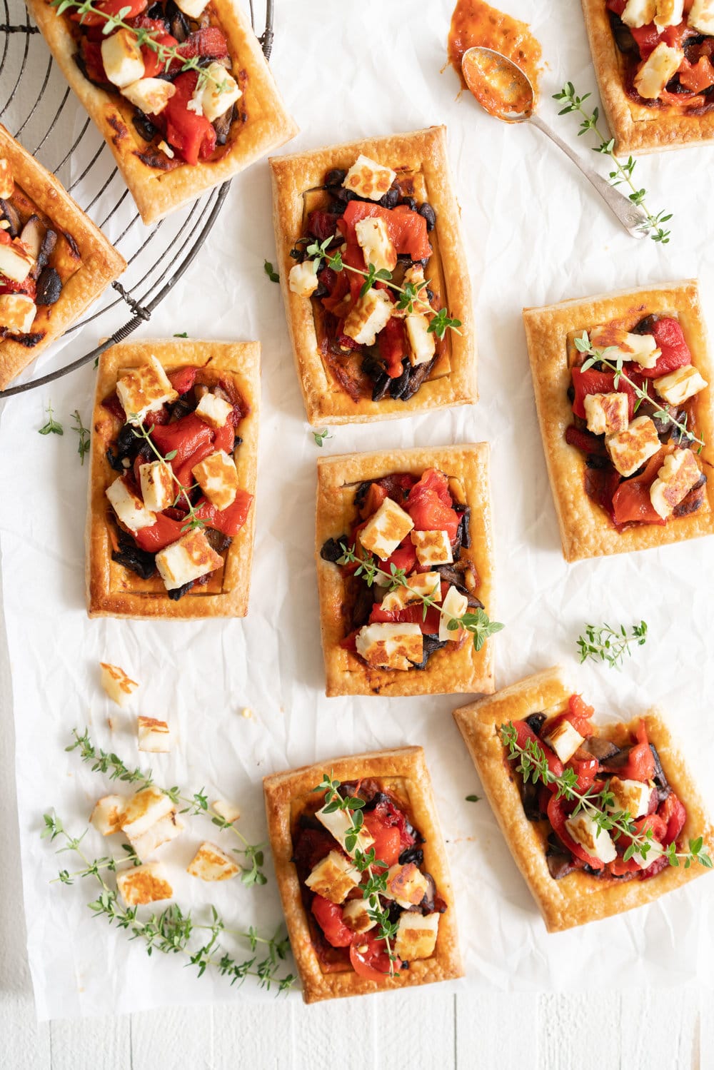 Chili Pesto, Mushroom, Roasted Red Pepper and Halloumi Tarts with Homemade Puff Pastry. The perfect appetizer or summer dinner - make these whatever size you want, they are bound to be a crowd pleaser! #mushroomtart #halloumi #chili #chilli #pesto #puffpastry #tart