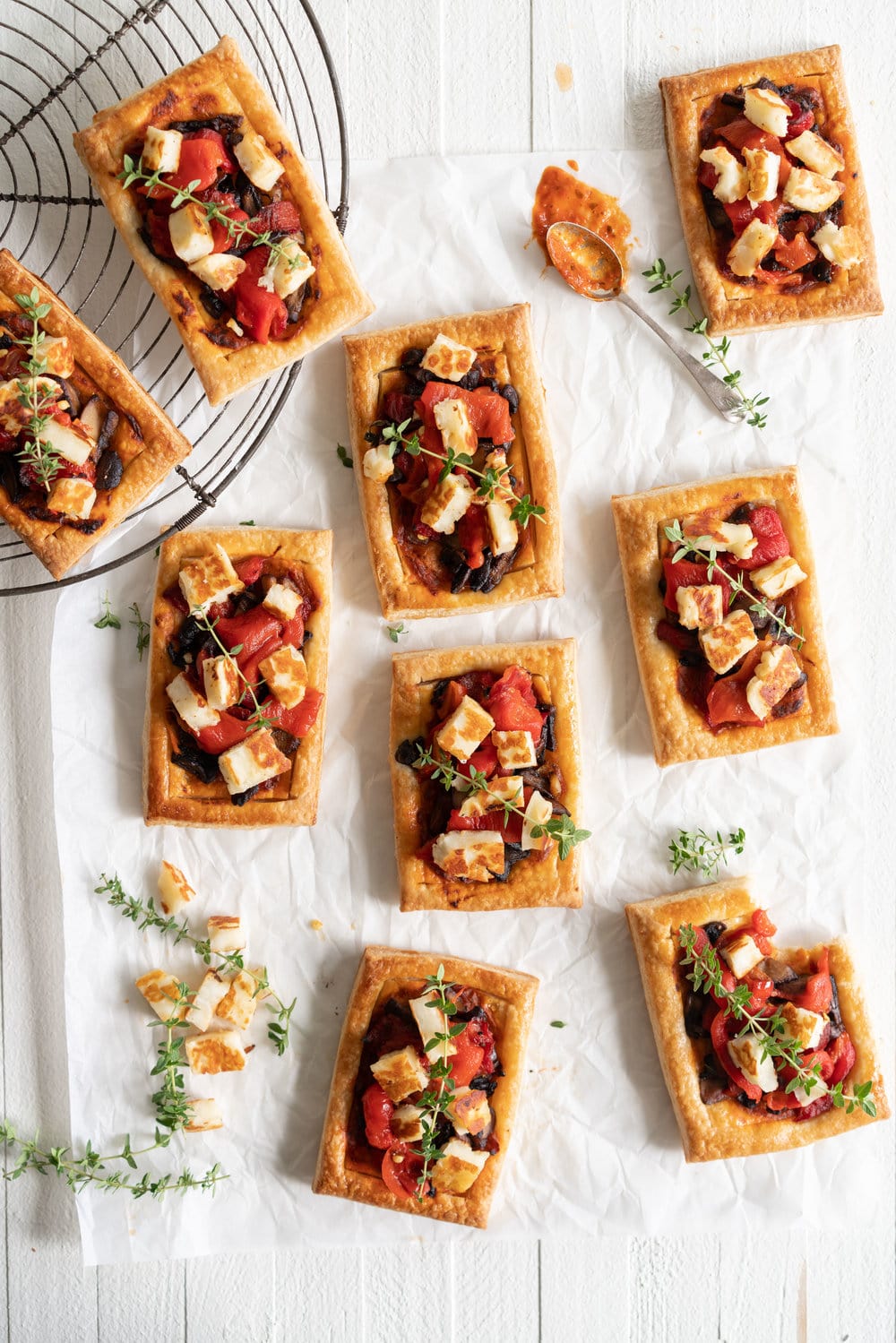 Chili Pesto, Mushroom, Roasted Red Pepper and Halloumi Tarts with Homemade Puff Pastry. The perfect appetizer or summer dinner - make these whatever size you want, they are bound to be a crowd pleaser! #mushroomtart #halloumi #chili #chilli #pesto #puffpastry #tart