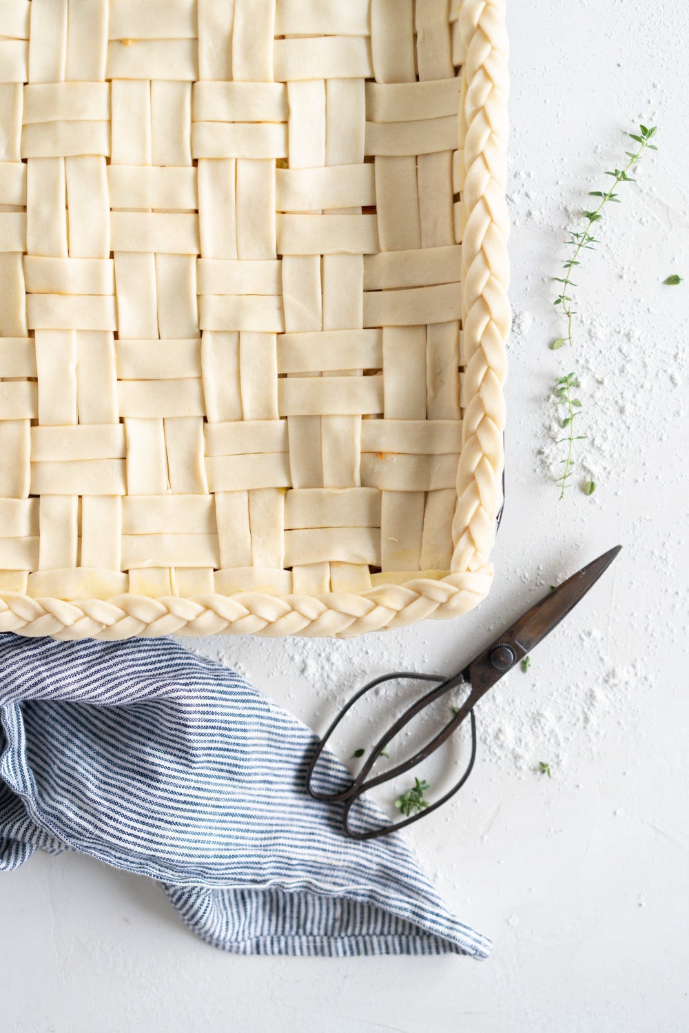Chicken, Leek and Sun dried Tomato Pesto Pie with Homemade Rough Puff Pastry - creamy chicken and leek filling is tucked into a flaky tender homemade rough puff pastry. Perfect to feed a crowd.