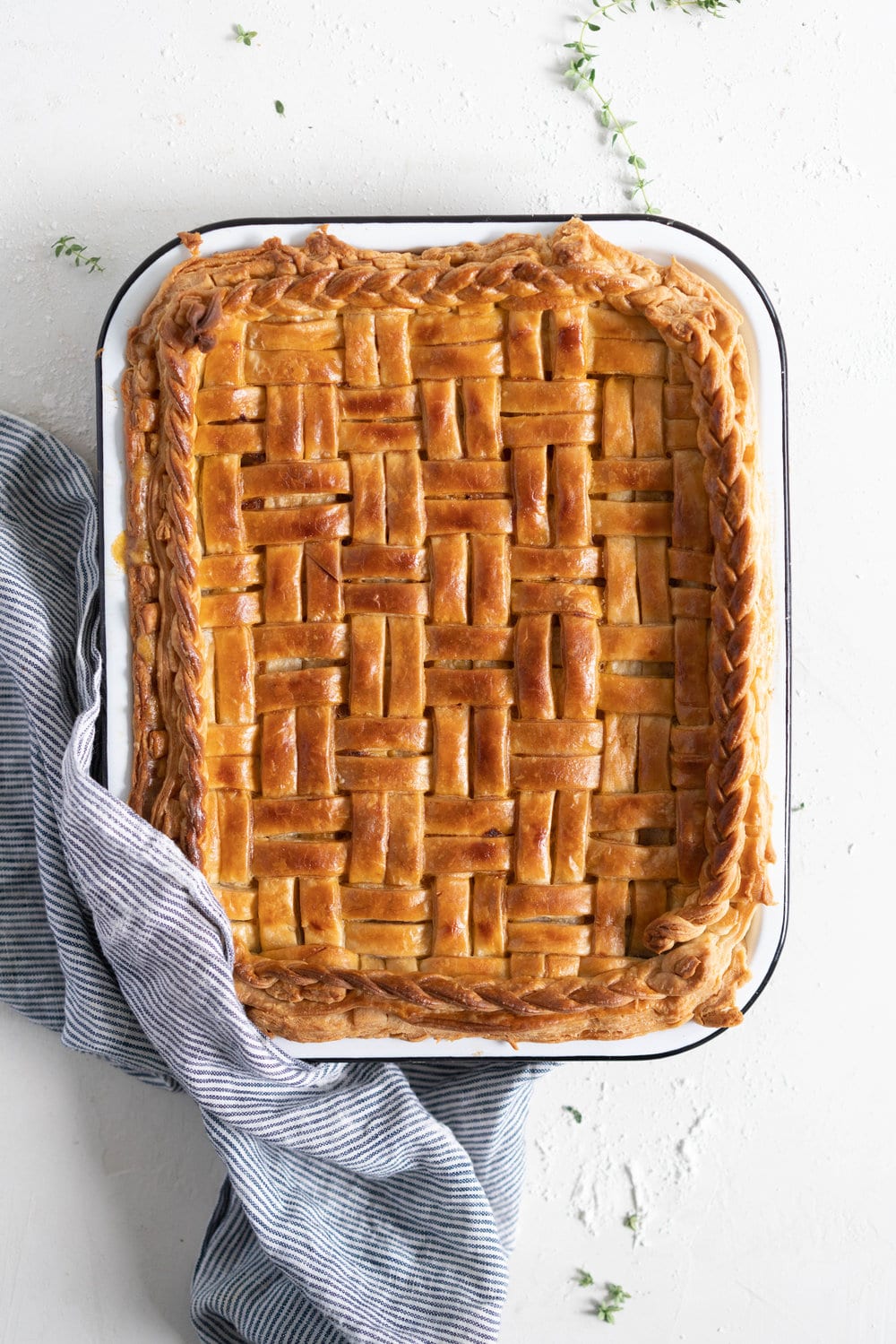 Chicken, Leek and Sun dried Tomato Pesto Pie with Homemade Rough Puff Pastry - creamy chicken and leek filling is tucked into a flaky tender homemade rough puff pastry. Perfect to feed a crowd.