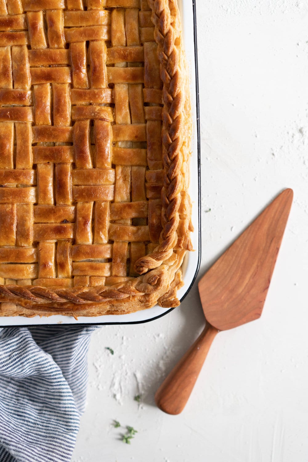 Chicken, Leek and Sun dried Tomato Pesto Pie with Homemade Rough Puff Pastry - creamy chicken and leek filling is tucked into a flaky tender homemade rough puff pastry. Perfect to feed a crowd.