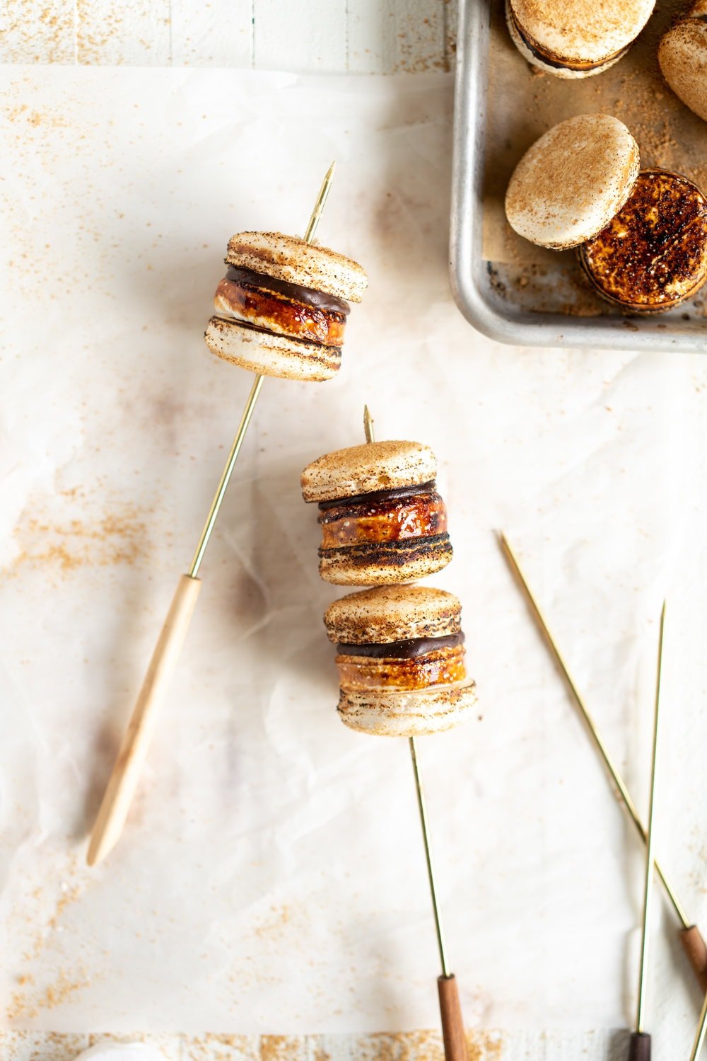 skewered macarons on a white background