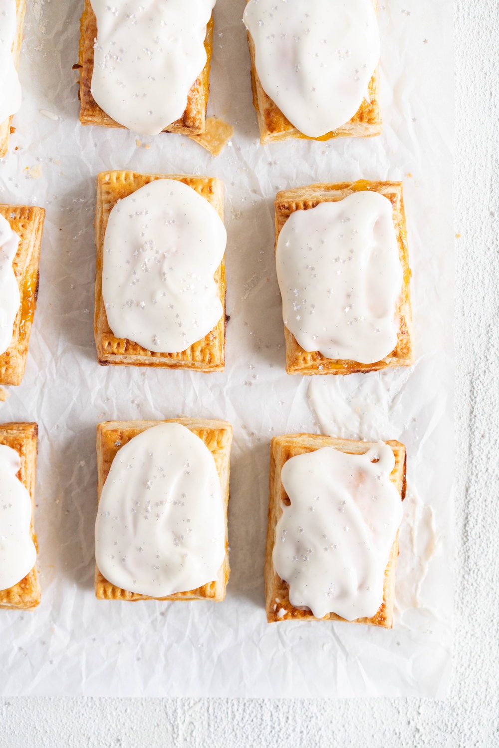 Apricot Pop Tarts with Vanilla Bean Icing - a quick apricot jam is enclosed in a buttery, flaky puff pastry, before being finished off with a vanilla bean icing. #poptart #pastry #apricot #jam #apricotjam #vanillabean