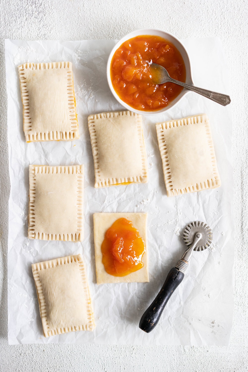 Apricot Pop Tarts with Vanilla Bean Icing - a quick apricot jam is enclosed in a buttery, flaky puff pastry, before being finished off with a vanilla bean icing. #poptart #pastry #apricot #jam #apricotjam #vanillabean