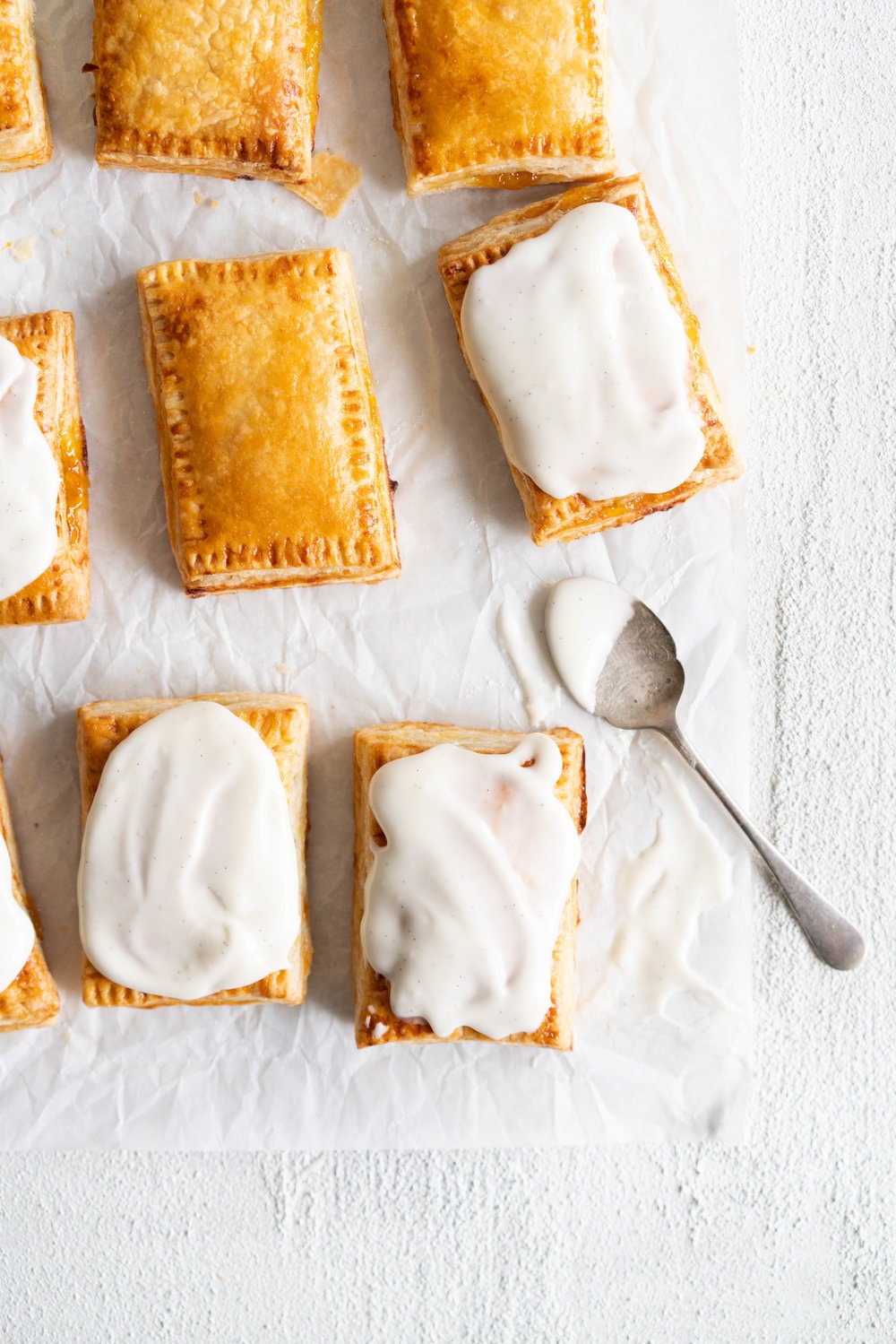 Apricot Pop Tarts with Vanilla Bean Icing - a quick apricot jam is enclosed in a buttery, flaky puff pastry, before being finished off with a vanilla bean icing. #poptart #pastry #apricot #jam #apricotjam #vanillabean