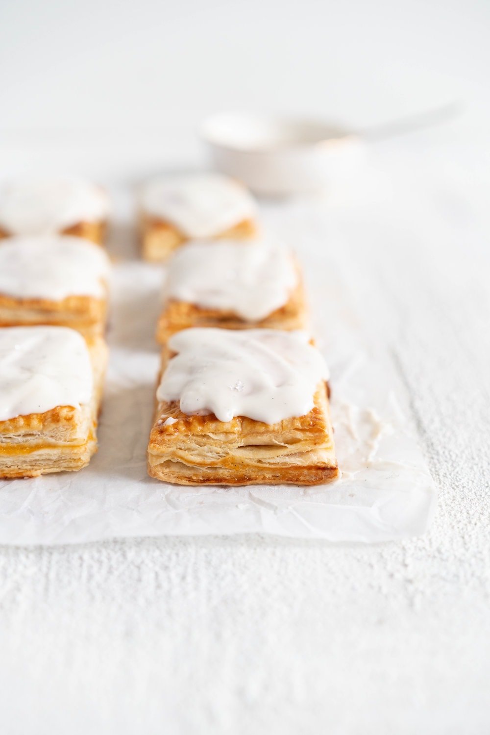 Apricot Pop Tarts with Vanilla Bean Icing - a quick apricot jam is enclosed in a buttery, flaky puff pastry, before being finished off with a vanilla bean icing. #poptart #pastry #apricot #jam #apricotjam #vanillabean