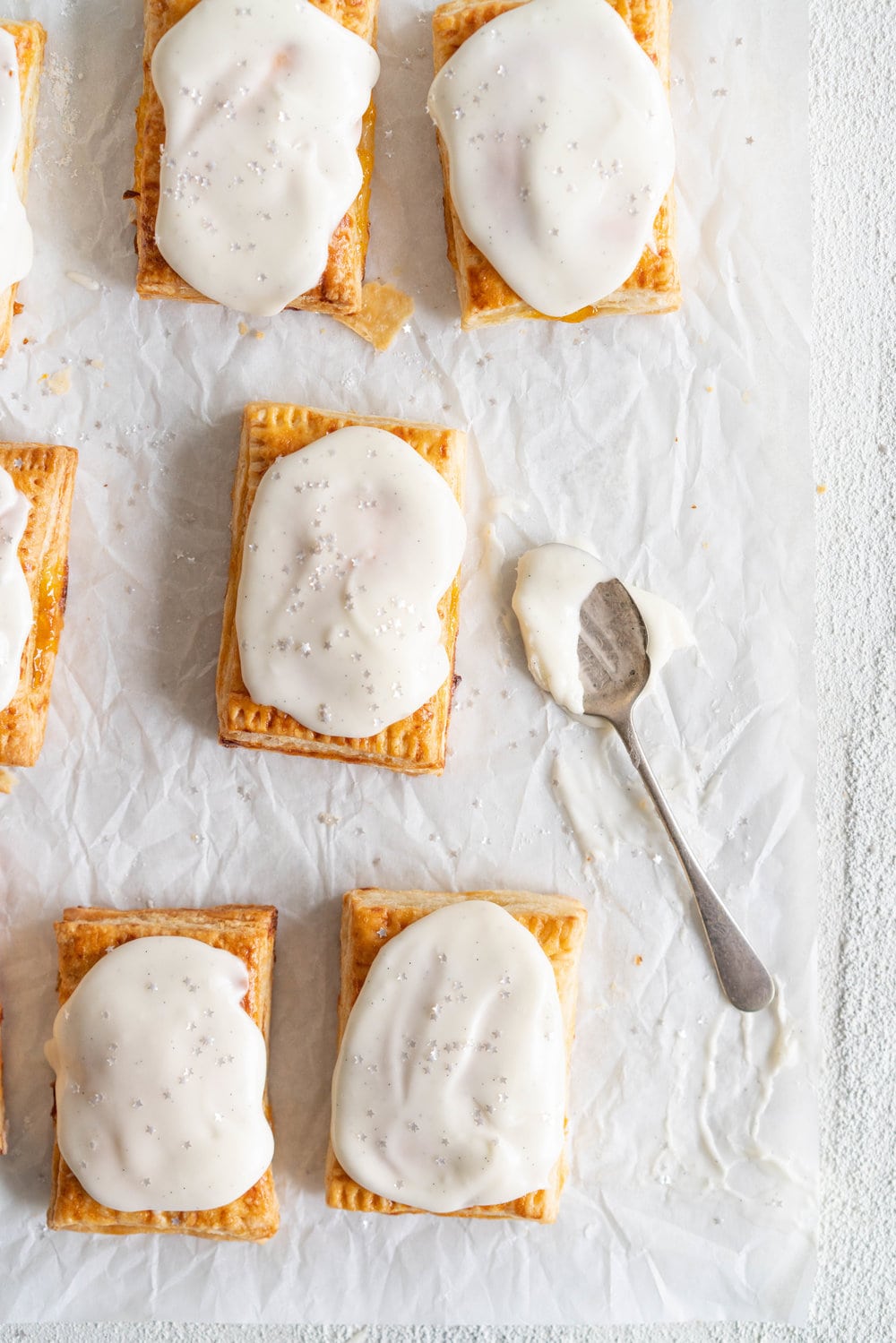 Apricot Pop Tarts with Vanilla Bean Icing - a quick apricot jam is enclosed in a buttery, flaky puff pastry, before being finished off with a vanilla bean icing. #poptart #pastry #apricot #jam #apricotjam #vanillabean